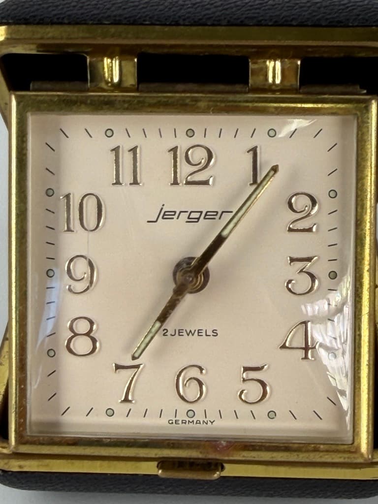 Set of two travel clocks, Junghans & Jerger, gold brass, black and burgundy faux leather, Germany, 1960s. - 364761