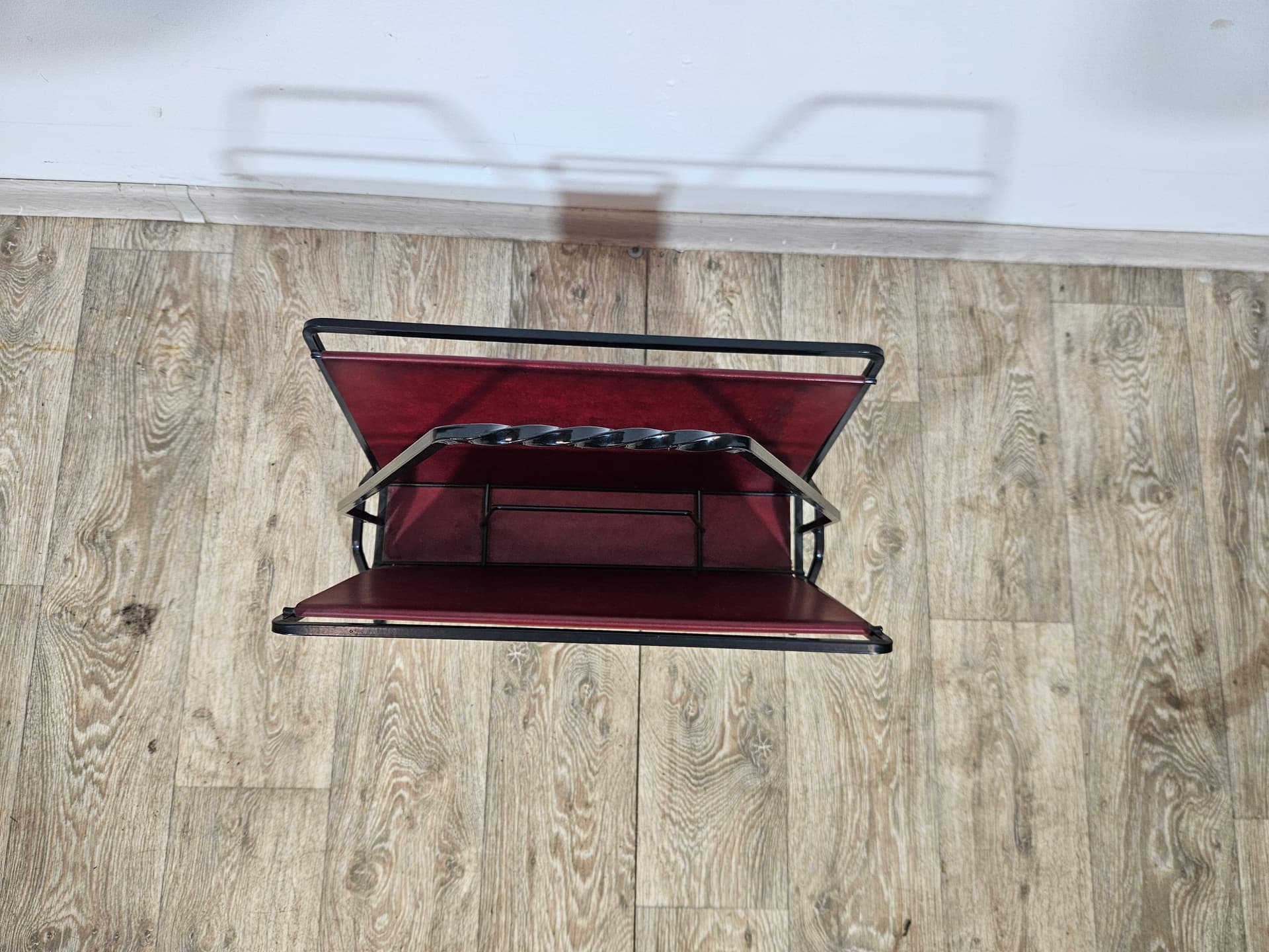 Magazine rack, burgundy leather, black metal, Germany, 1960s. - 366006