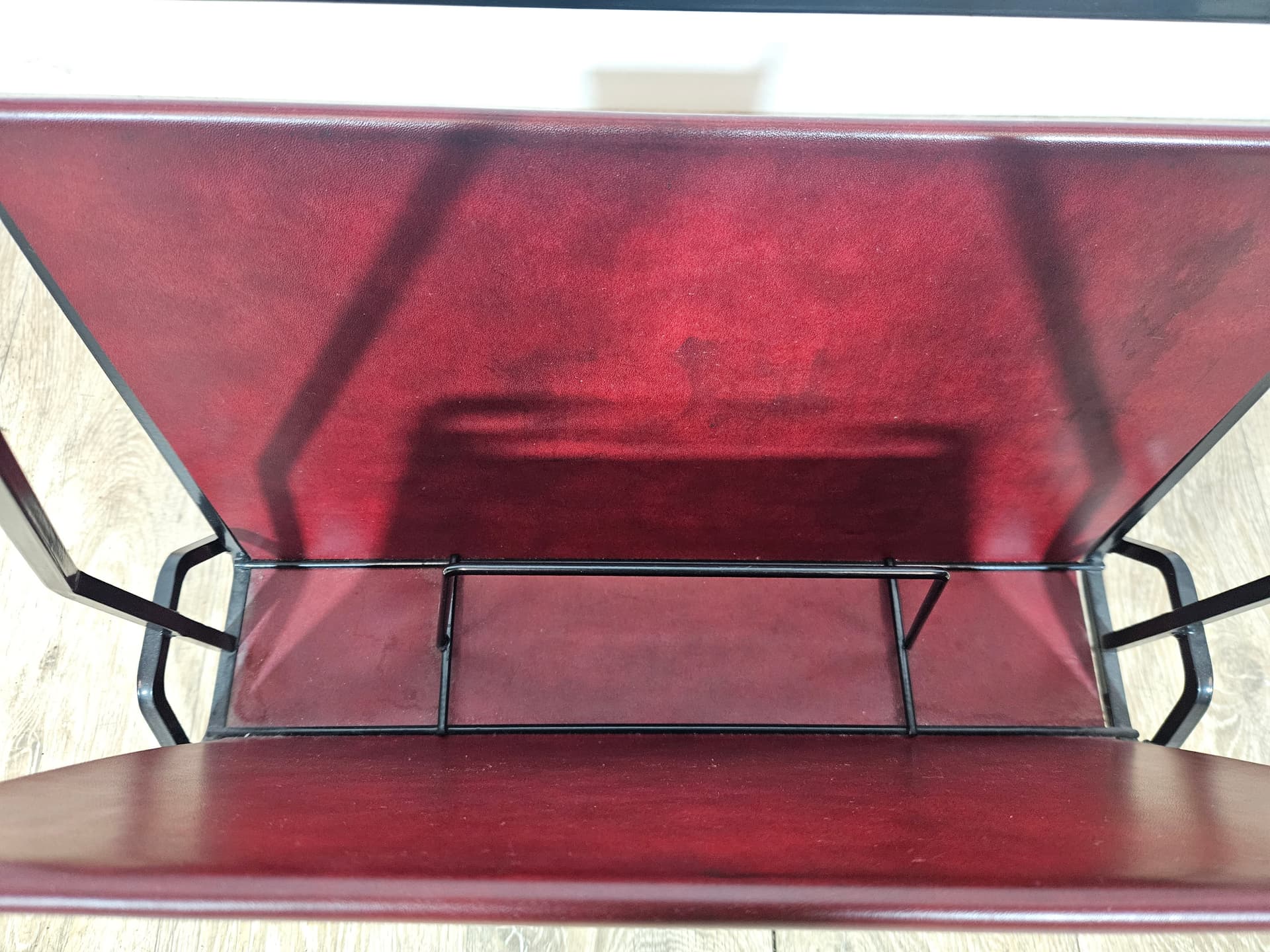 Magazine rack, burgundy leather, black metal, Germany, 1960s. - 366007