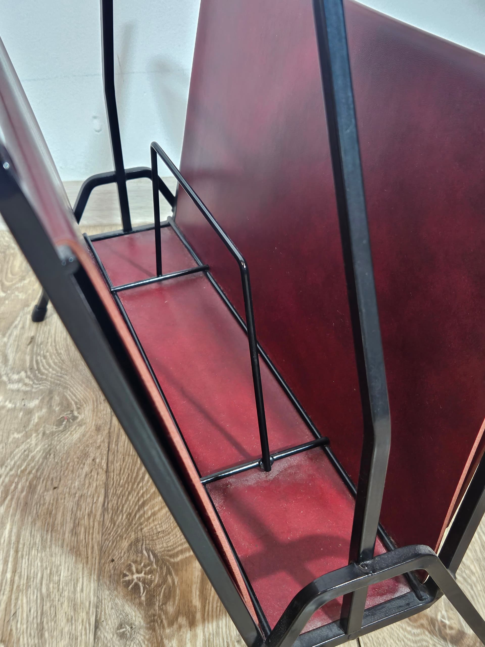 Magazine rack, burgundy leather, black metal, Germany, 1960s. - 366000