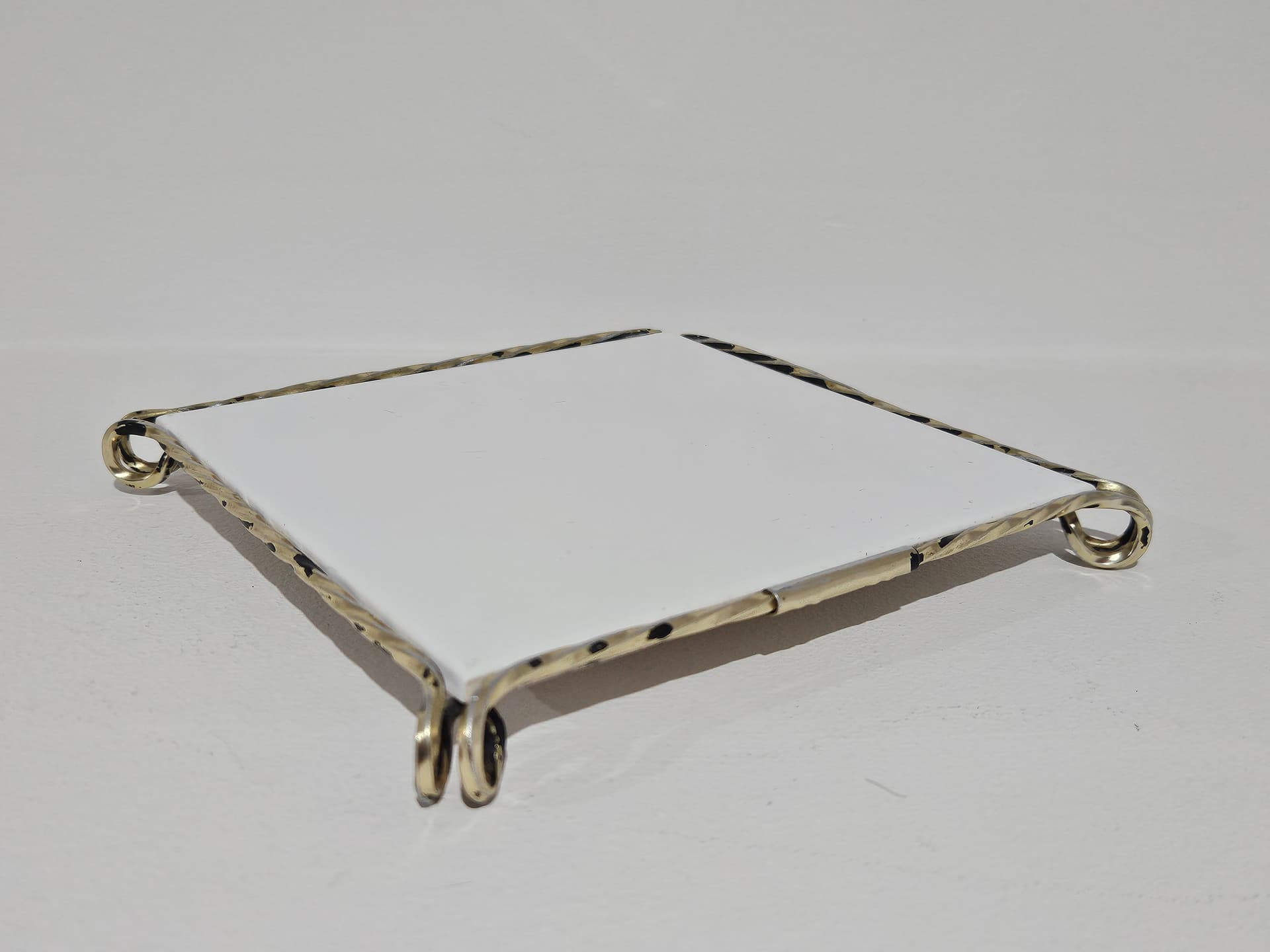 Trivet, white ceramic, golden brass, Germany, 1980s. - 366157