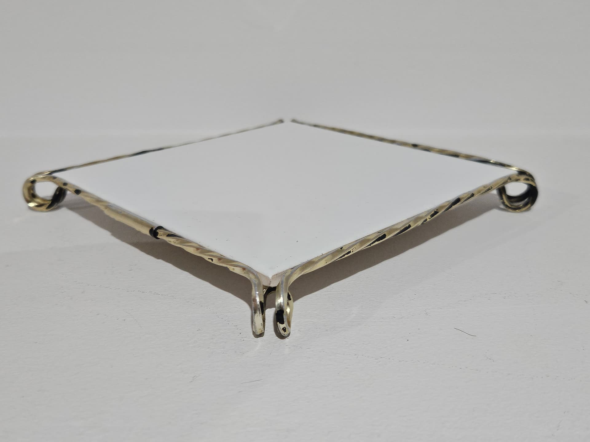 Trivet, white ceramic, golden brass, Germany, 1980s. - 366159