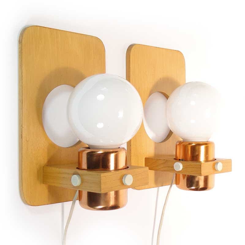 Pair of wall sconces, brown beech, golden copper, Poland, 1960s.