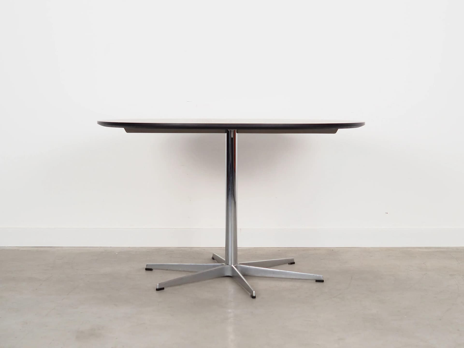 Round table, black ash, grey metal, by A. Jacobsen, Fritz Hansen, Denmark, 1960s.