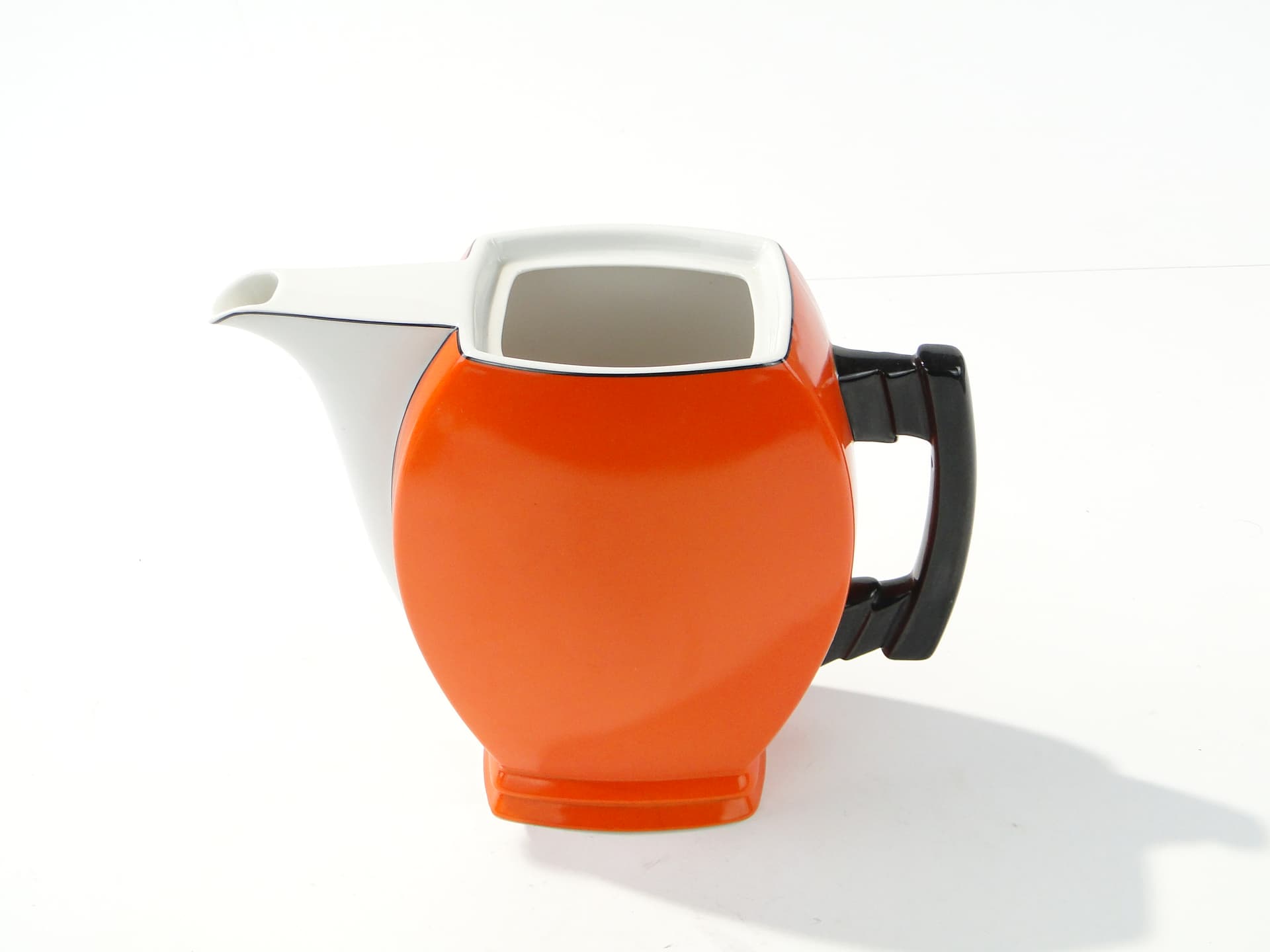 Coffee pot Płaski, orange white black, porcelain, by B. Wendorf, Ćmielów, 1930s. - 388084