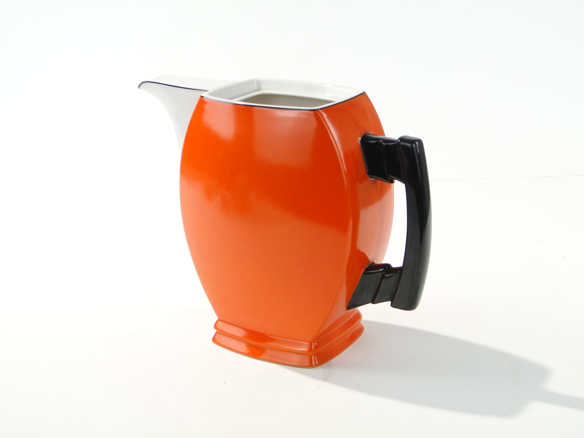 Coffee pot Płaski, orange white black, porcelain, by B. Wendorf, Ćmielów, 1930s. - 388089