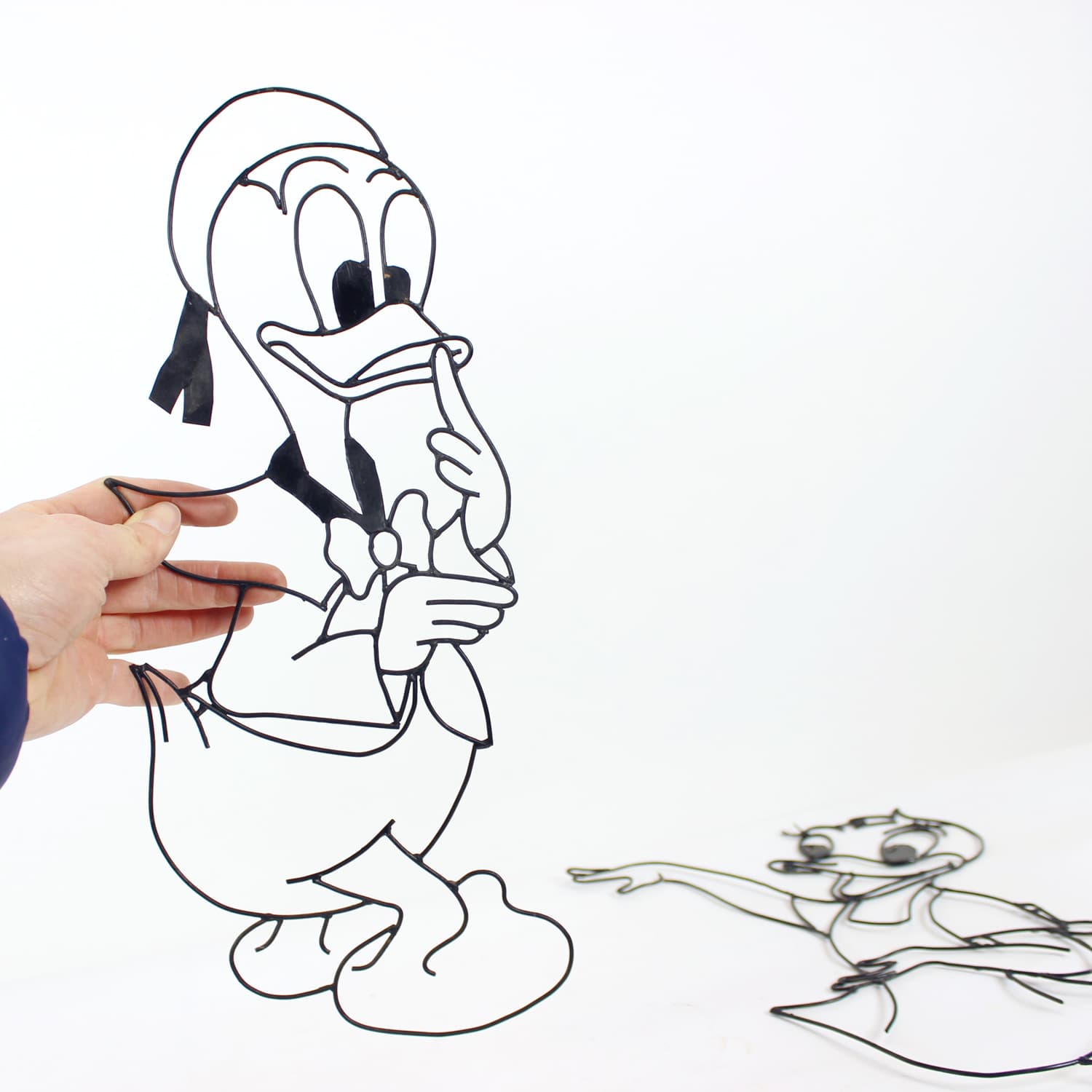 Set of two wall decorations Donald & Daisy Duck, black metal, Disney, Austria, 1960s - 389408