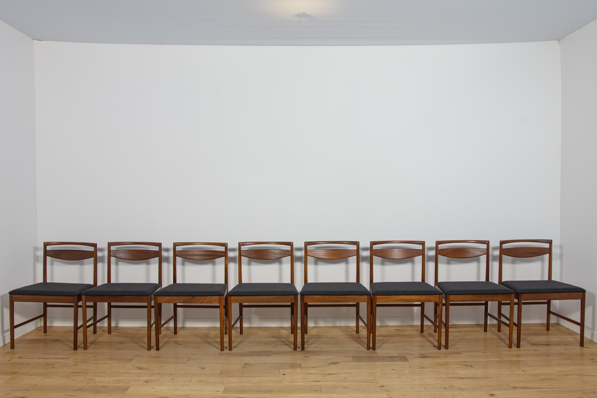 set of eight chairs Model 9513, brown teak, black fabric, by T. Robertson, for A.H. McIntosh & Co., United Kingdom, 1970s - 393528