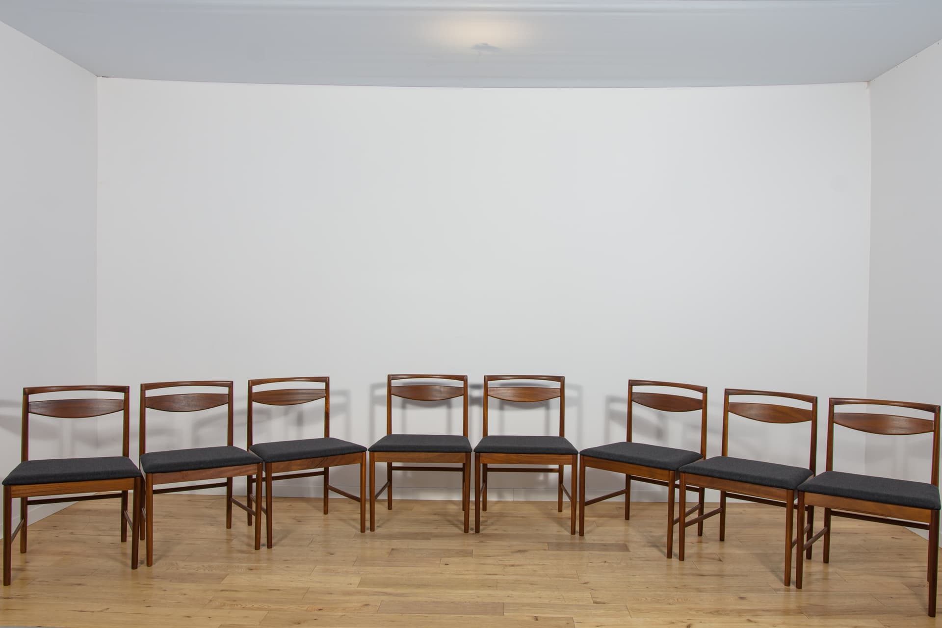 set of eight chairs Model 9513, brown teak, black fabric, by T. Robertson, for A.H. McIntosh & Co., United Kingdom, 1970s - 393526