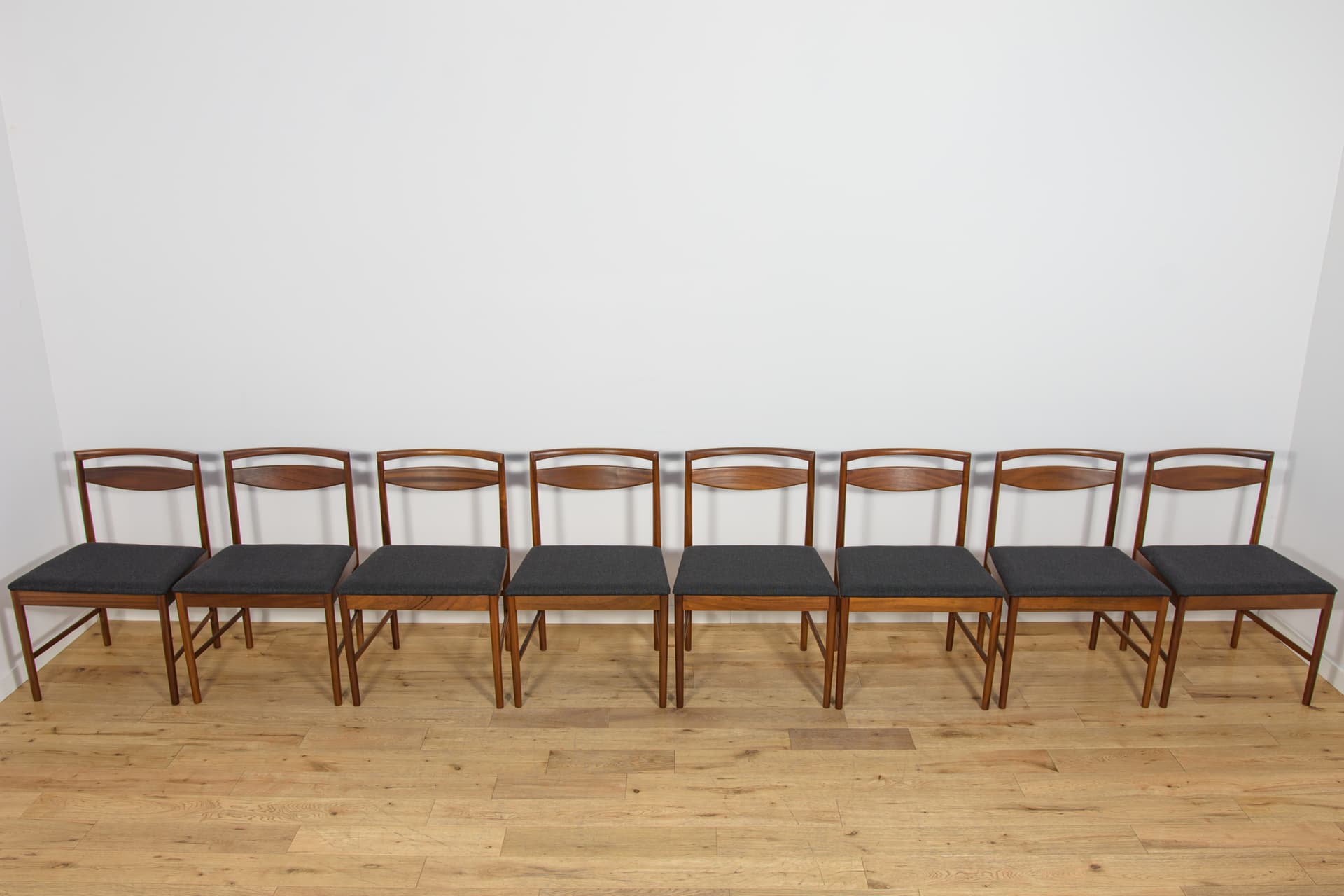 set of eight chairs Model 9513, brown teak, black fabric, by T. Robertson, for A.H. McIntosh & Co., United Kingdom, 1970s - 393529