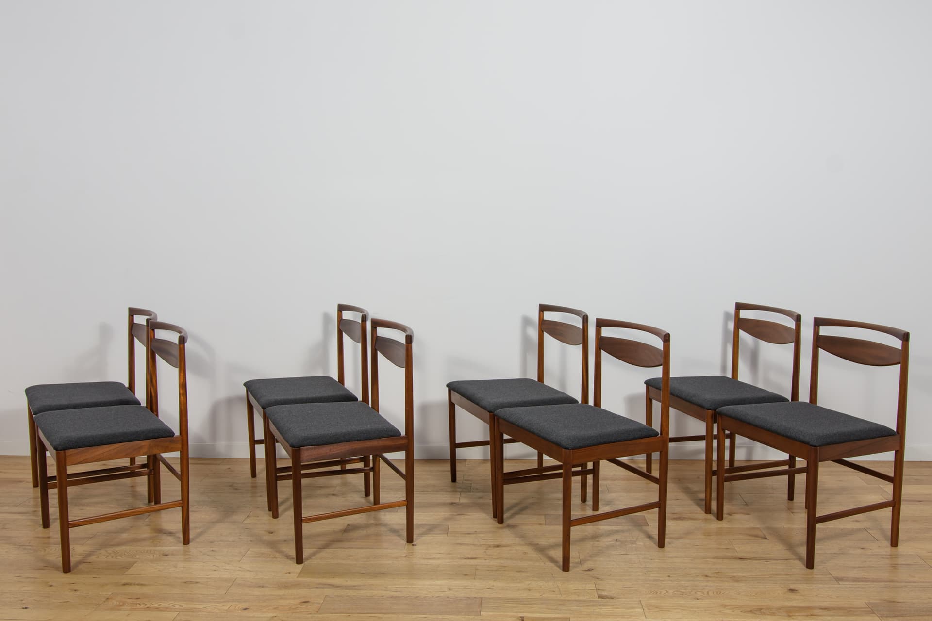 set of eight chairs Model 9513, brown teak, black fabric, by T. Robertson, for A.H. McIntosh & Co., United Kingdom, 1970s - 393527