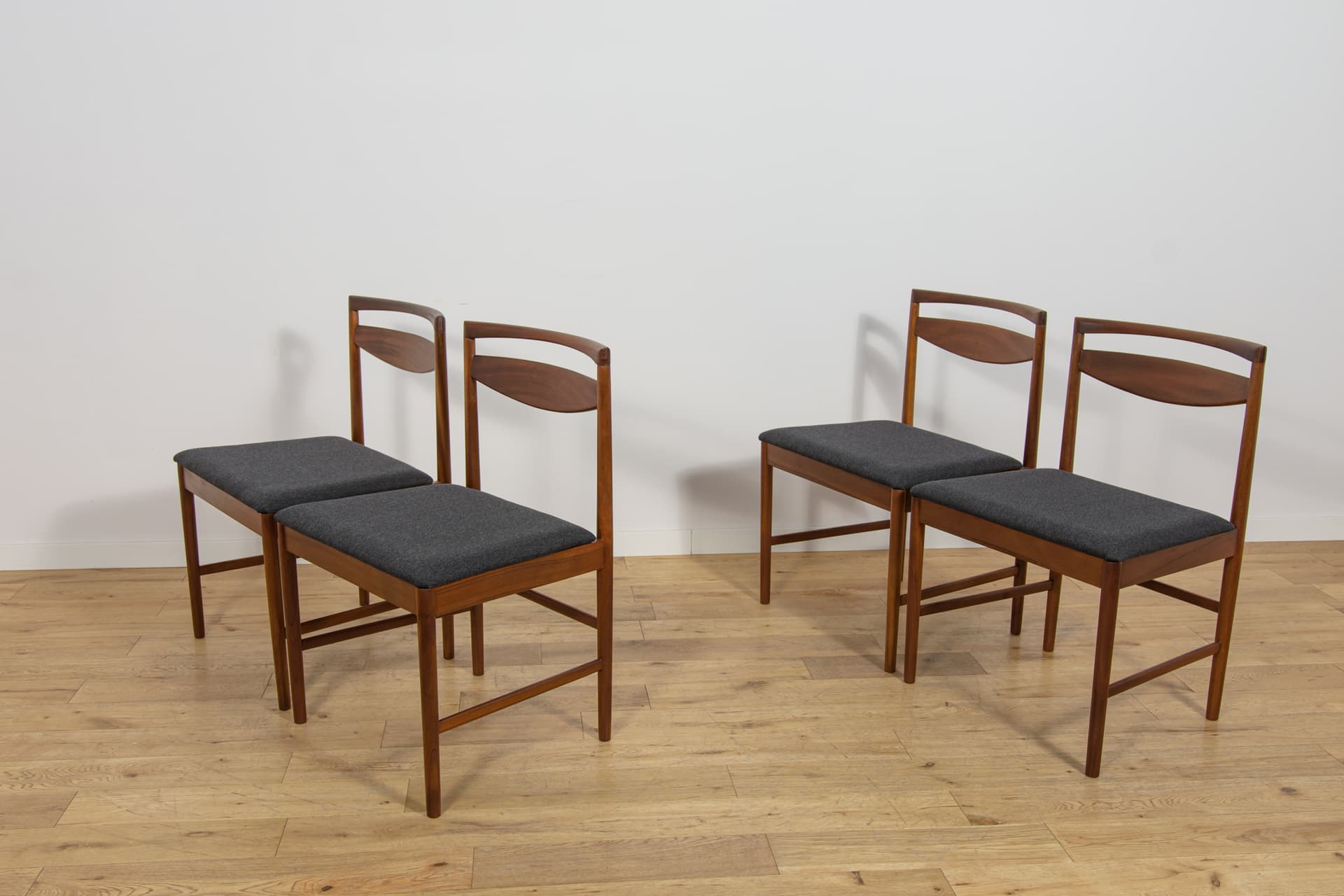 Set of four chairs Model 9513, brown teak, black fabric, by T. Robertson, for A.H. McIntosh & Co., United Kingdom, 1970s. - 393670