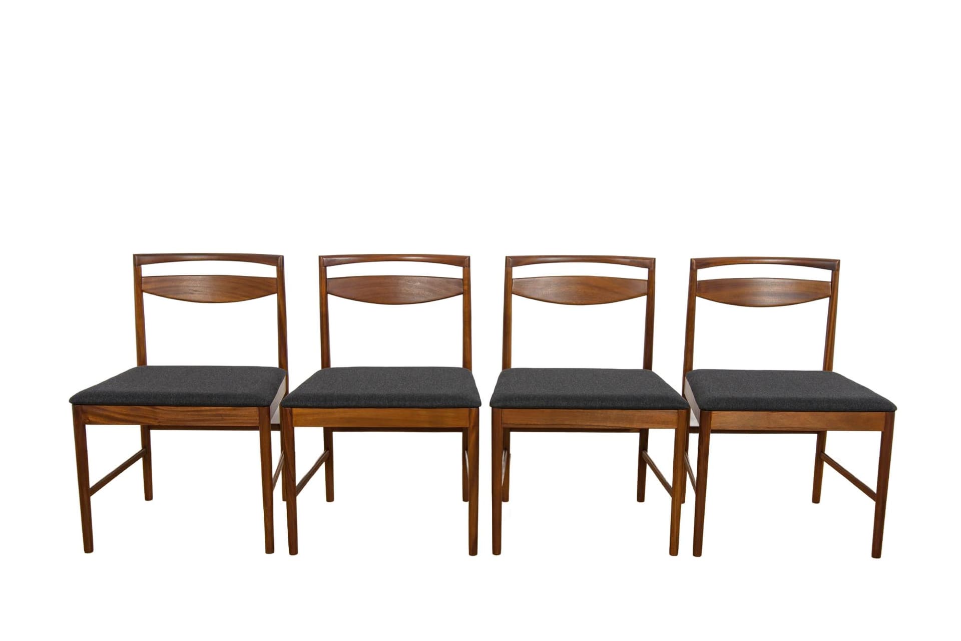 Set of four chairs Model 9513, brown teak, black fabric, by T. Robertson, for A.H. McIntosh & Co., United Kingdom, 1970s.