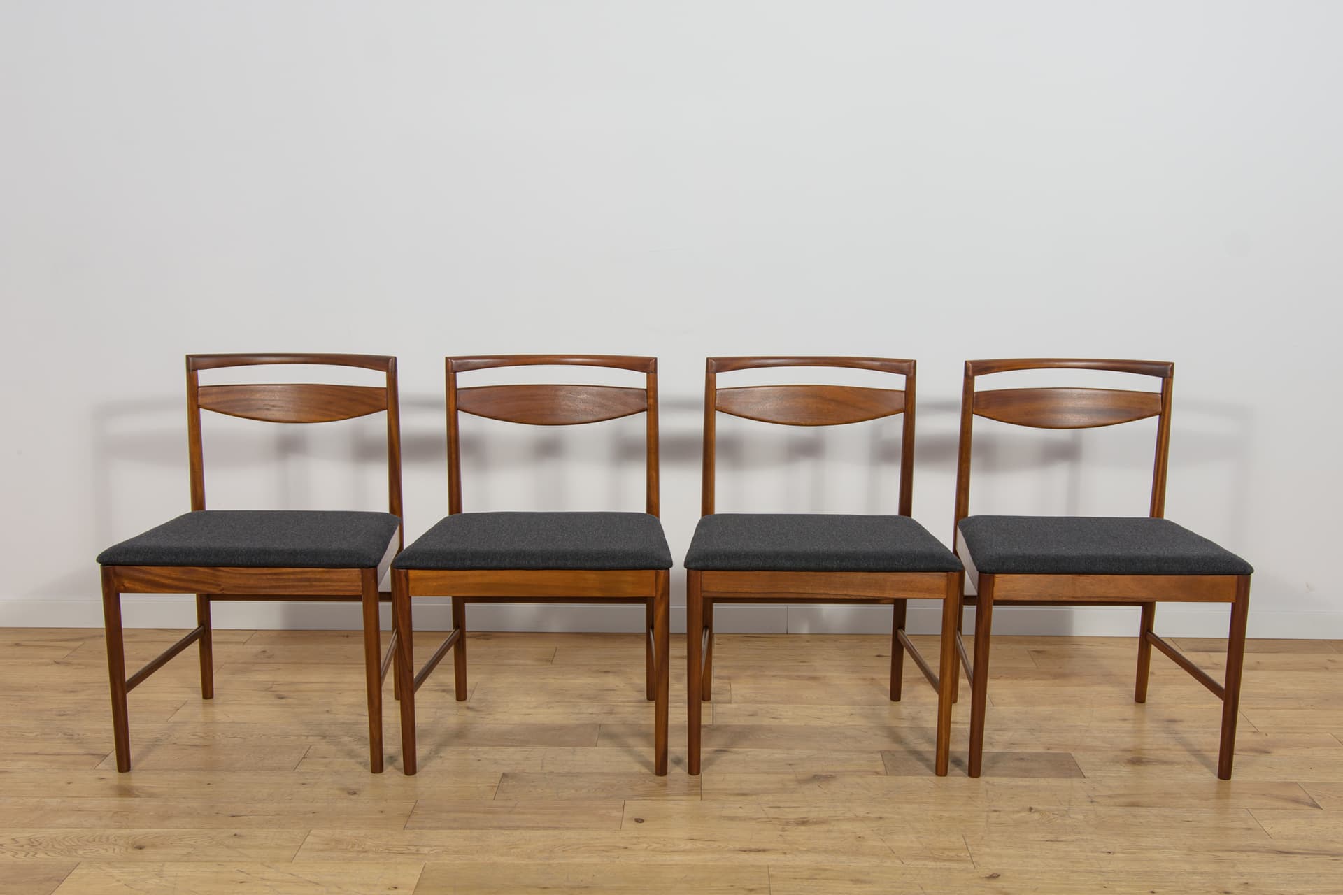 Set of four chairs Model 9513, brown teak, black fabric, by T. Robertson, for A.H. McIntosh & Co., United Kingdom, 1970s. - 393666