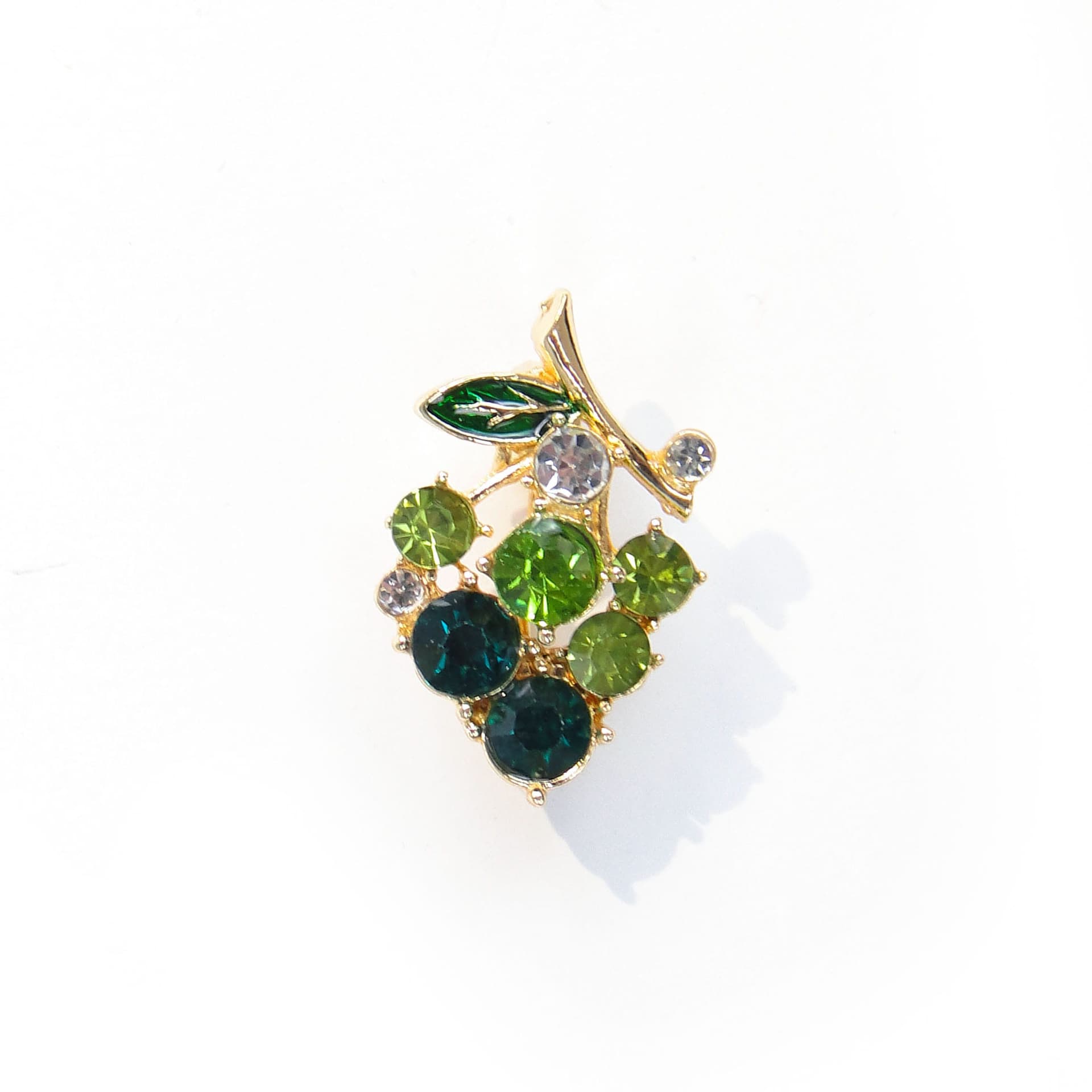 Brooch grape cluster, gold green clear, metal glass enamel, Jablonex, Czech Republic, 1990s.