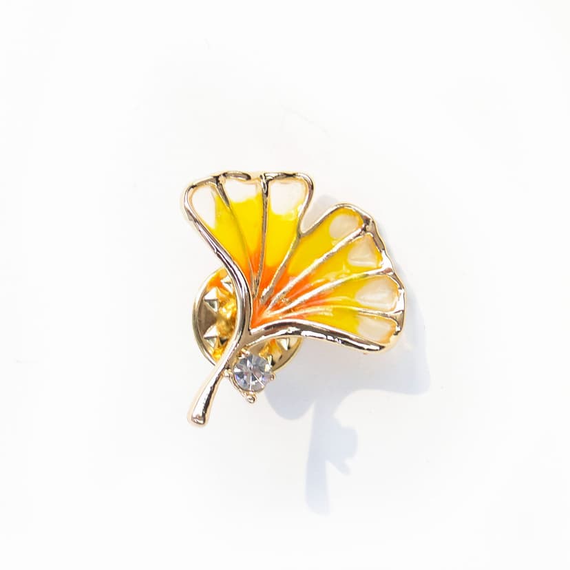 Brooch Ginkgo Leaf, yellow orange enamel, gold metal, Jablonex, Czech Republic, 1990s.