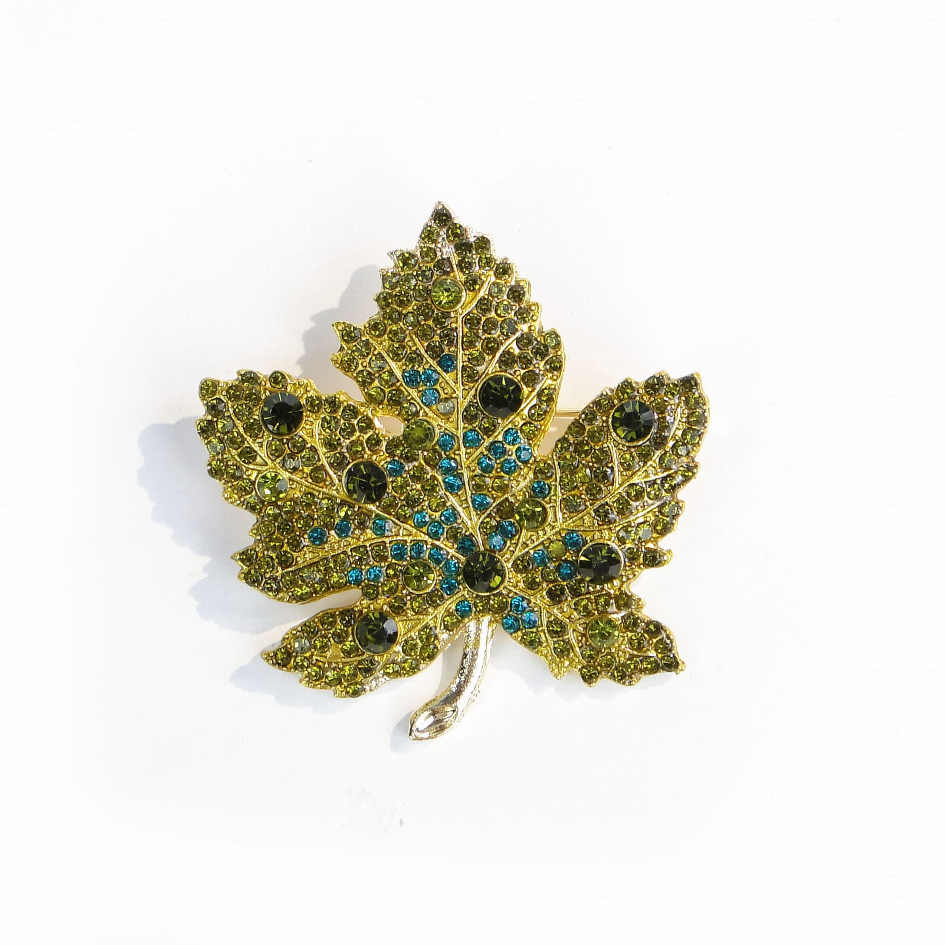 Brooch maple leaf, gold green blue silver, metal enamel cubic zirconia, Jablonex, Czech Republic, 1990s.