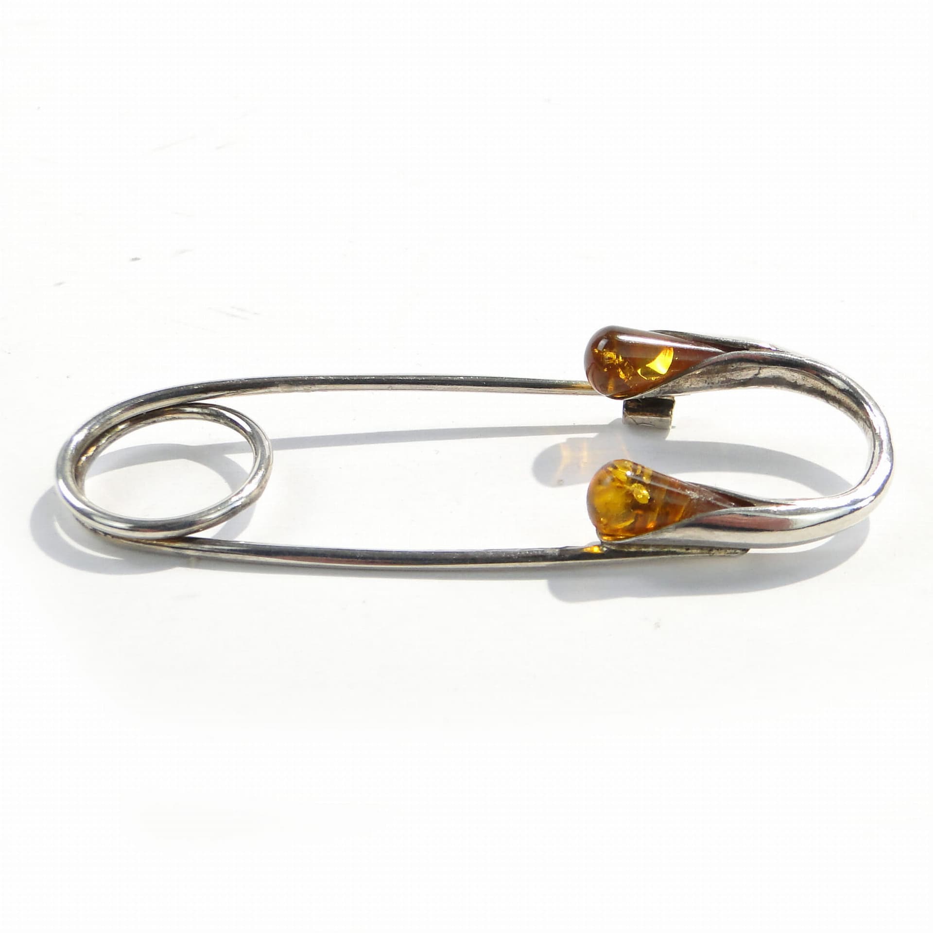 Safety pin, silver silver, yellow amber, Poland, 1970s. - 394485