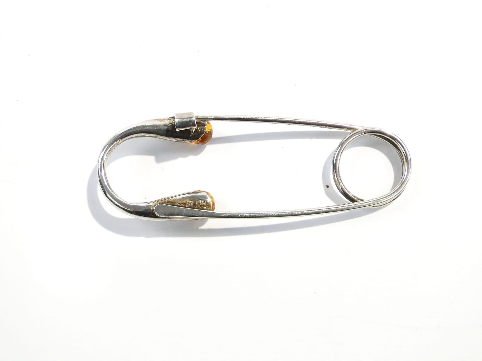 Safety pin, silver silver, yellow amber, Poland, 1970s. - 394482