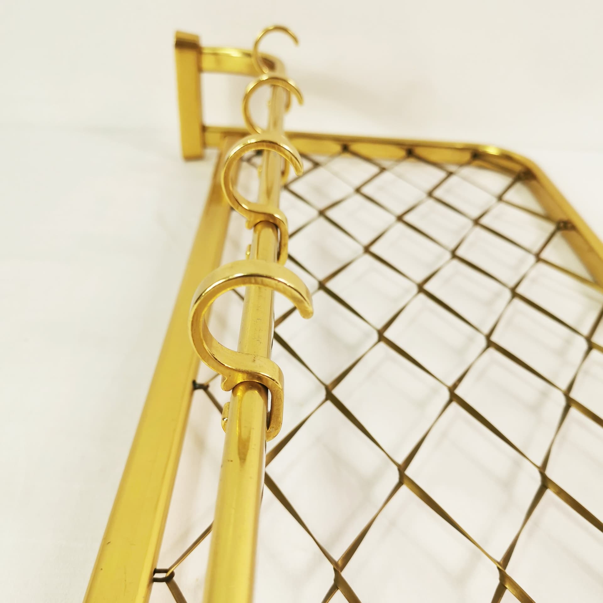 Wall-mounted coat rack Art Deco, gold aluminium, black plastic, Germany, 1960s. - 394581
