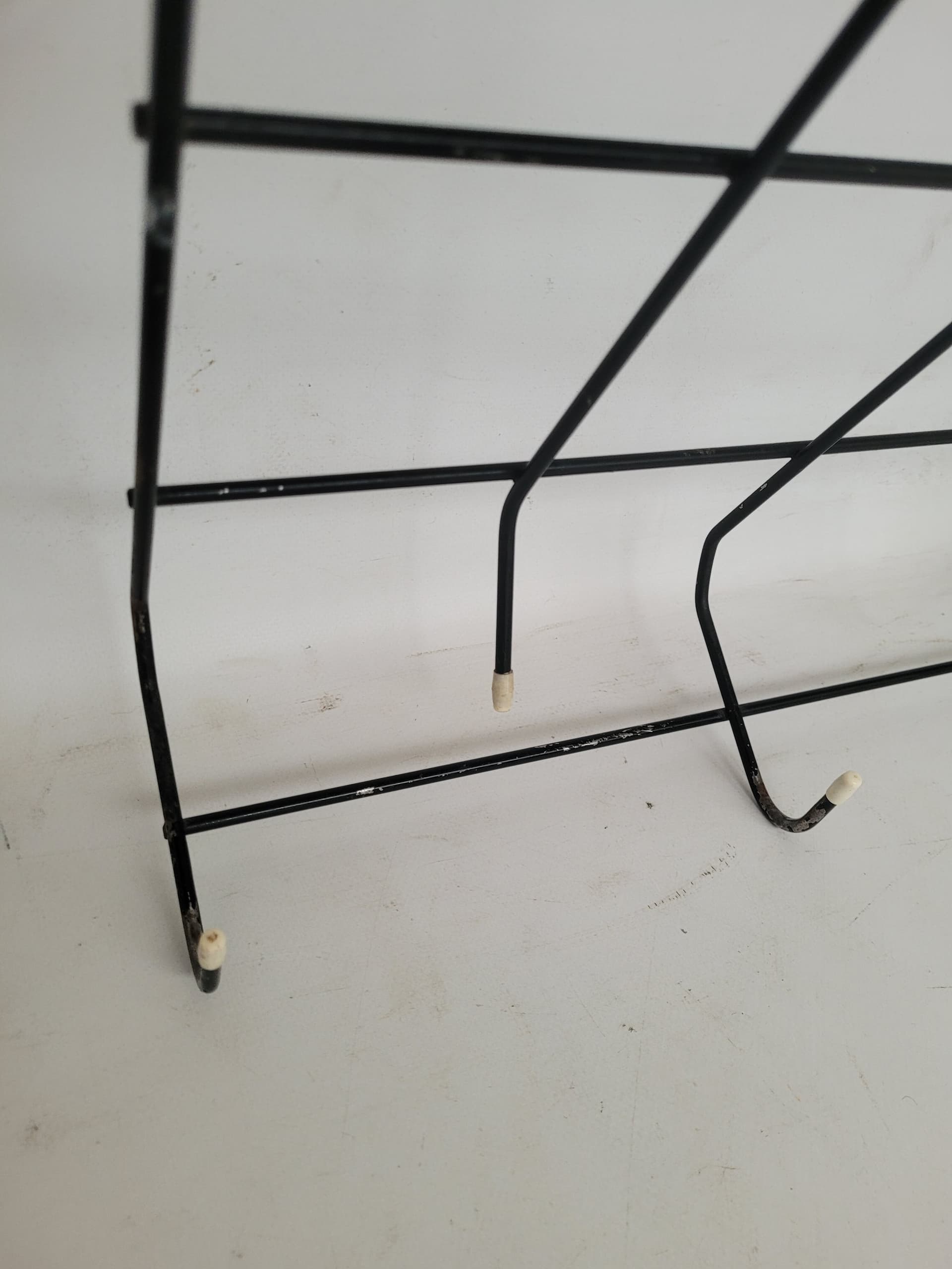 Wall-mounted coat rack String, black metal, white plastic, 1960s - 399365
