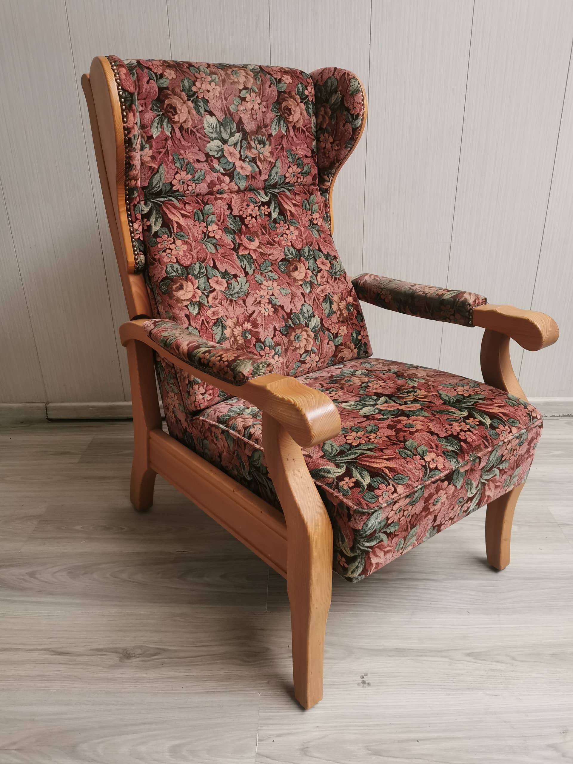 Reclining wingback armchair, pink floral fabric, light brown wood, 1990s. - 400969