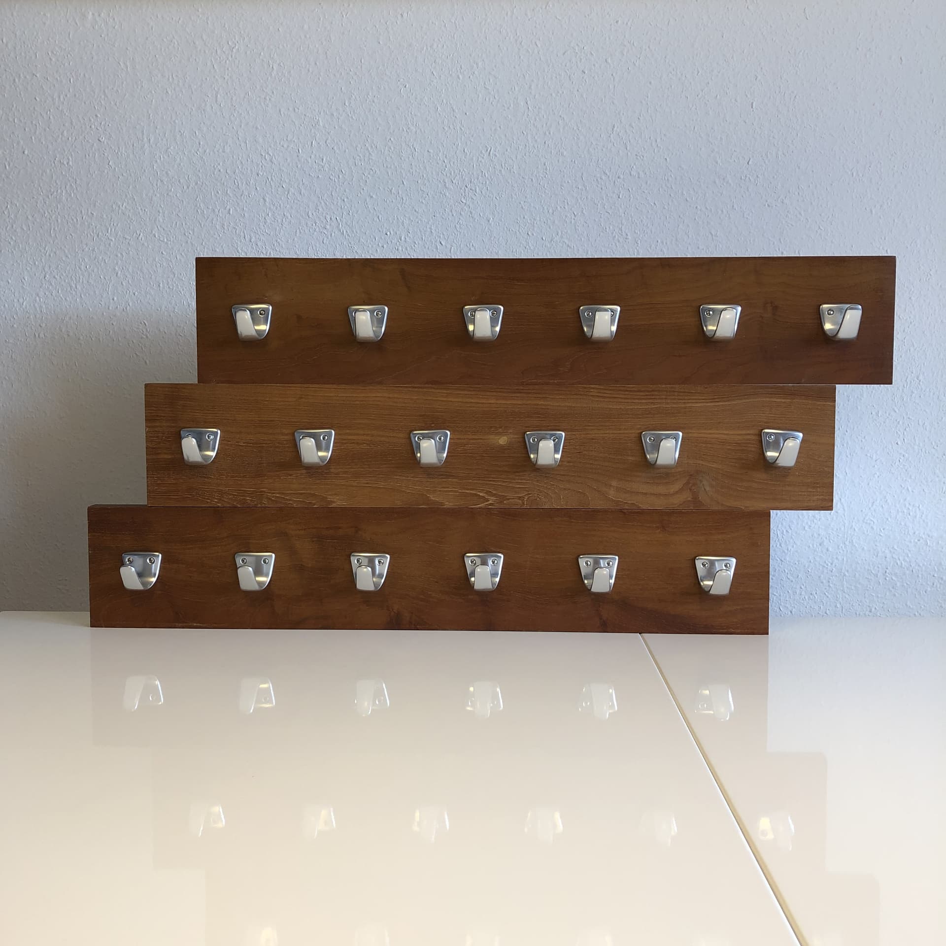 Wall-mounted coat rack, brown teak, silver aluminium, Germany, 1970s. - 33673