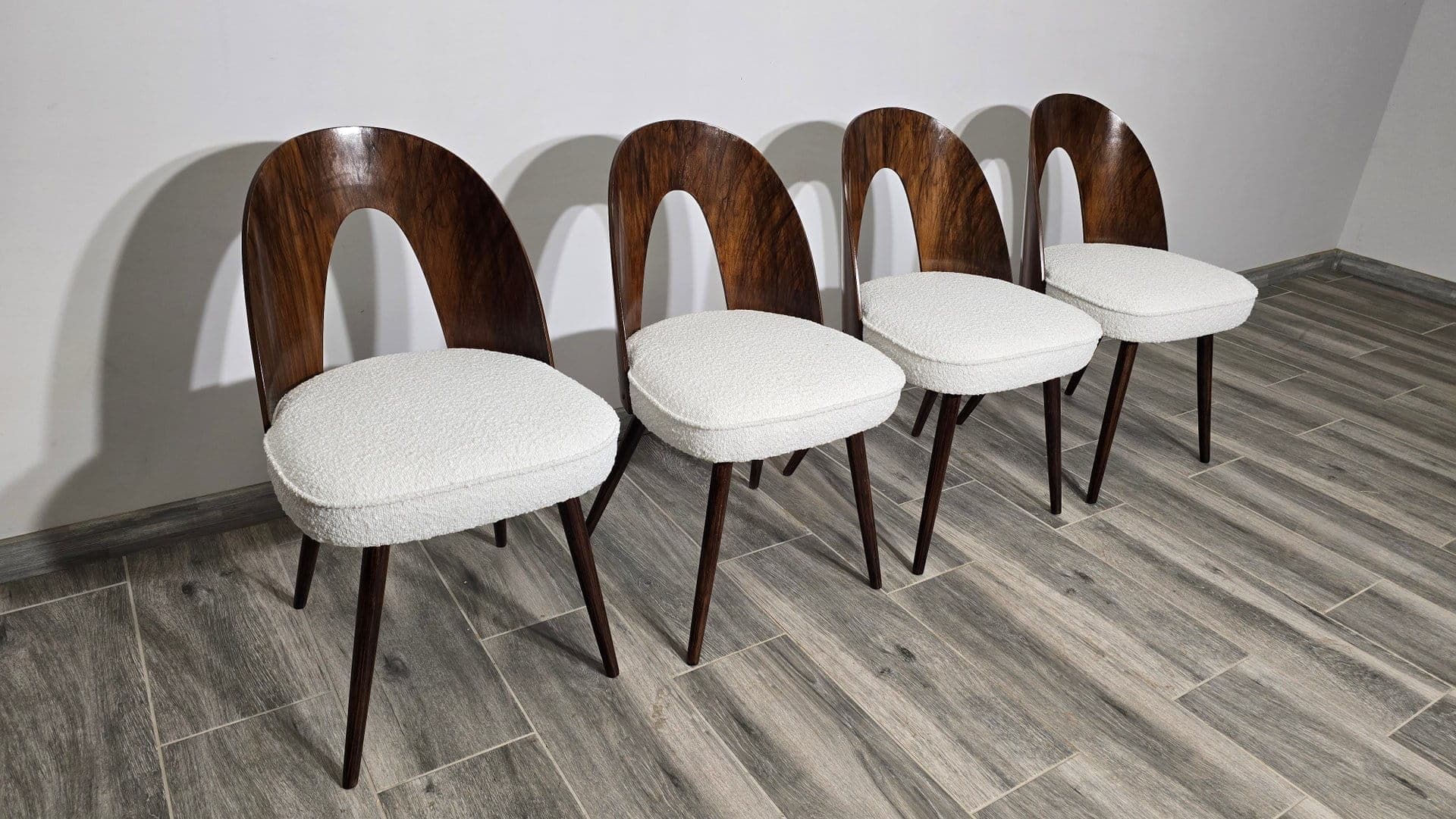 Set of four chairs, off-white bouclé, dark brown plywood, by A. Šuman, Tatra Nabytok, Czechoslovakia, 1960s. - 48235