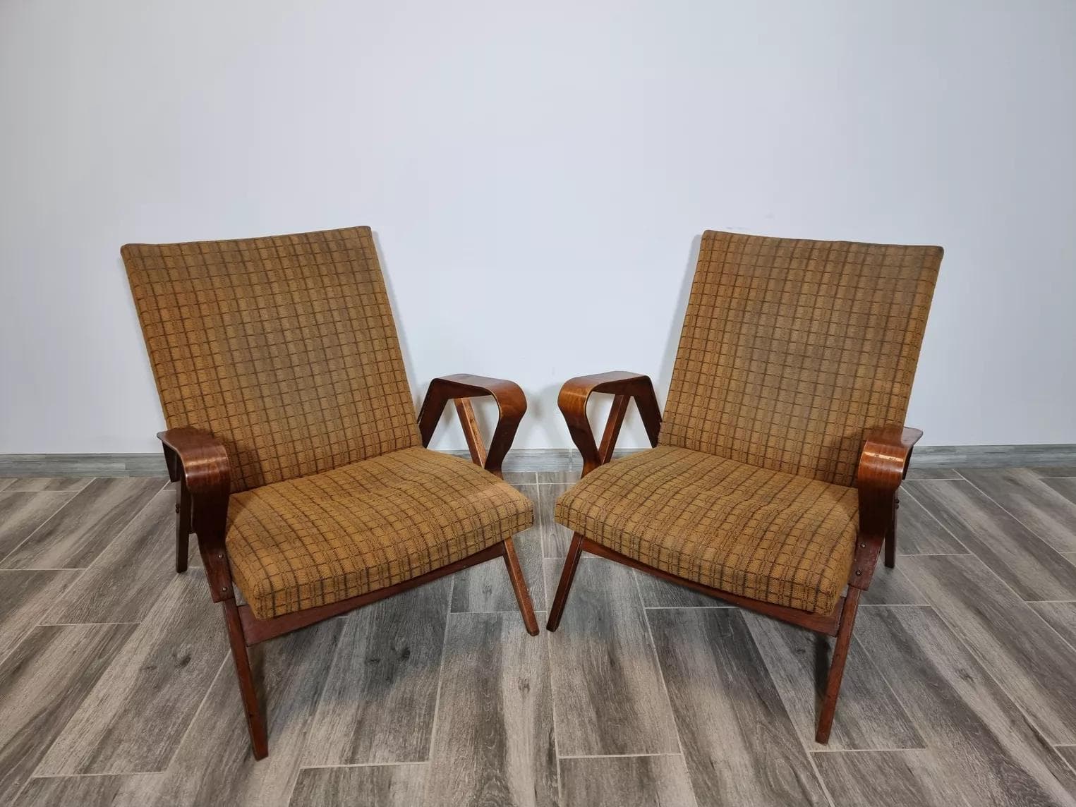 Pair of armchairs, dark brown plywood, by F. Jirak, Tatra Nabytok, Czechoslovakia, 1960s. - 48831