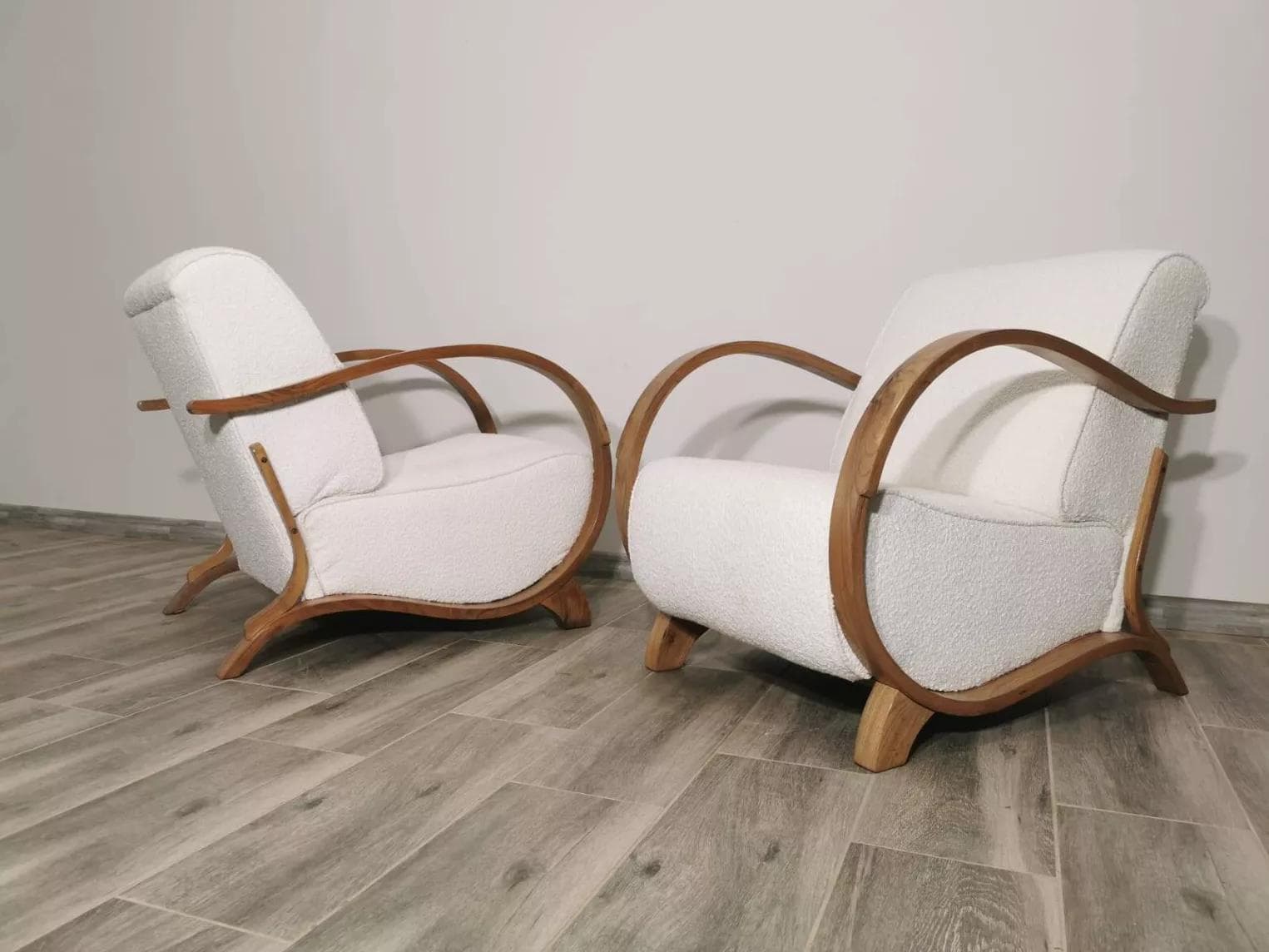 Pair of armchairs, honey wood, ivory bouclé, by J. Halabala, UP Závody, Czechoslovakia, 1960s. - 48714