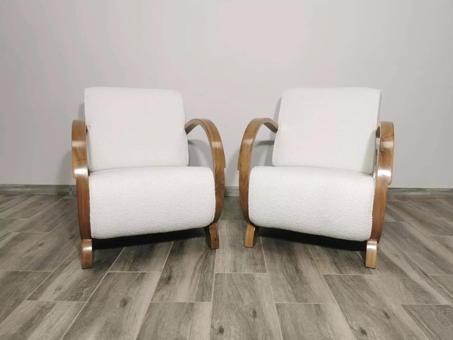Pair of armchairs, honey wood, ivory bouclé, by J. Halabala, UP Závody, Czechoslovakia, 1960s. - 48715