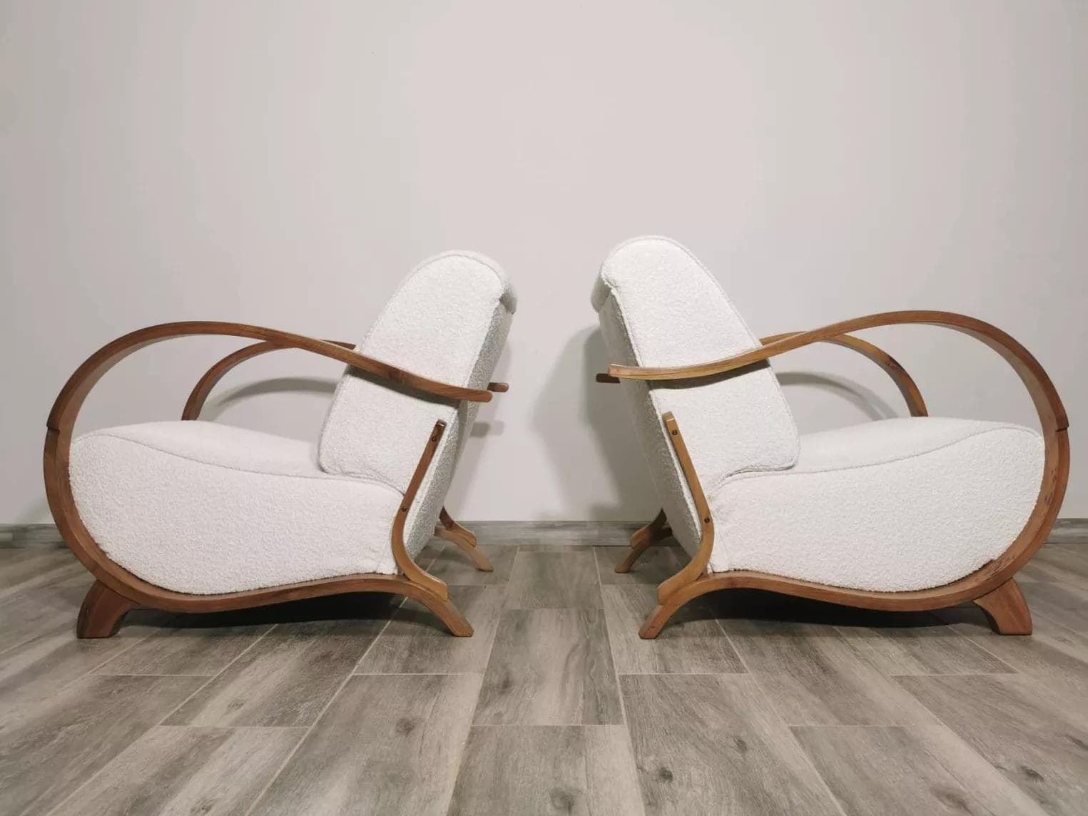 Pair of armchairs, honey wood, ivory bouclé, by J. Halabala, UP Závody, Czechoslovakia, 1960s. - 48713