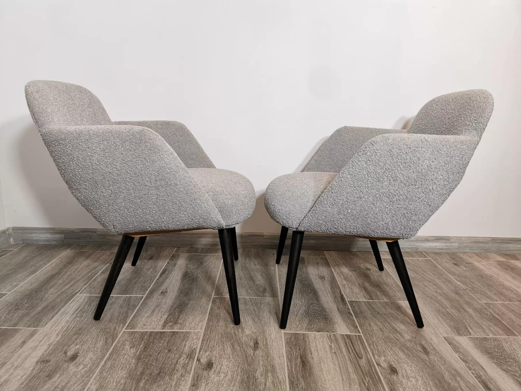 Pair of armchairs, light grey bouclé, black wood, Czechoslovakia, 1950s. - 48551