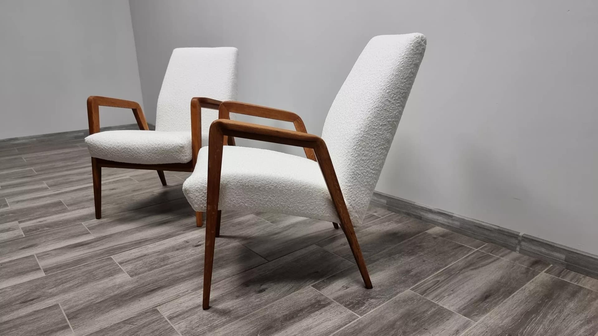 Pair of armchairs, ivory bouclé, oak-stained beech, by J. Vanek, UP Závody, Czechoslovakia, 1930s. - 48523