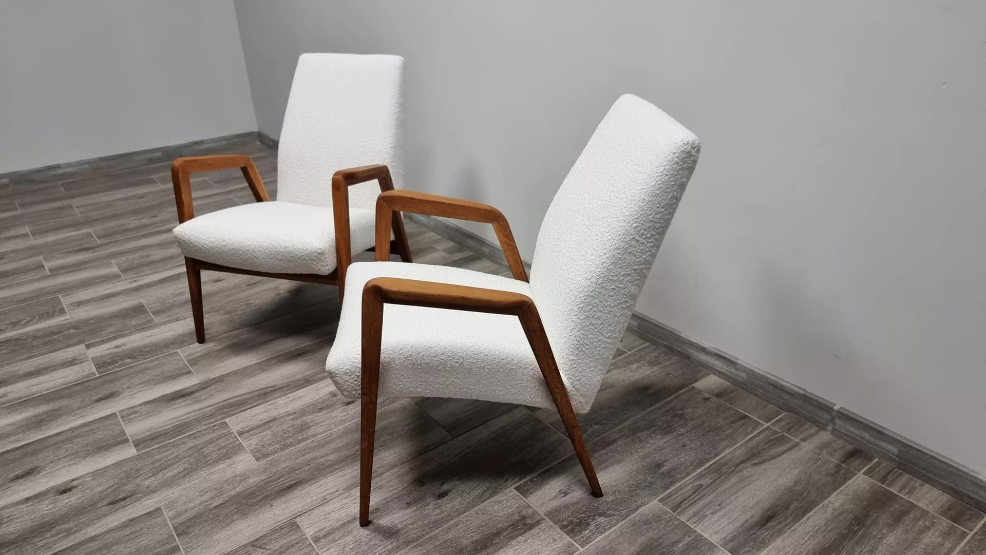Pair of armchairs, ivory bouclé, oak-stained beech, by J. Vanek, UP Závody, Czechoslovakia, 1930s. - 48522
