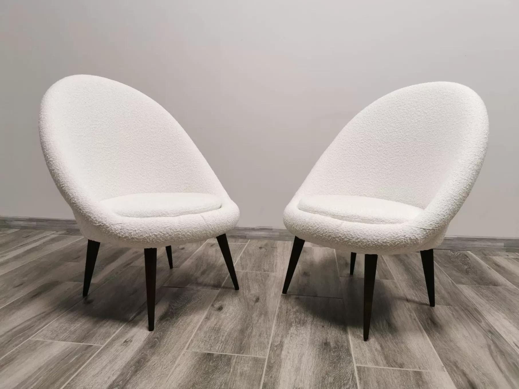 Pair of armchairs, white bouclé, wood, by L. Volak, Tatra Nabytok, Czechoslovakia, 1950s. - 48519