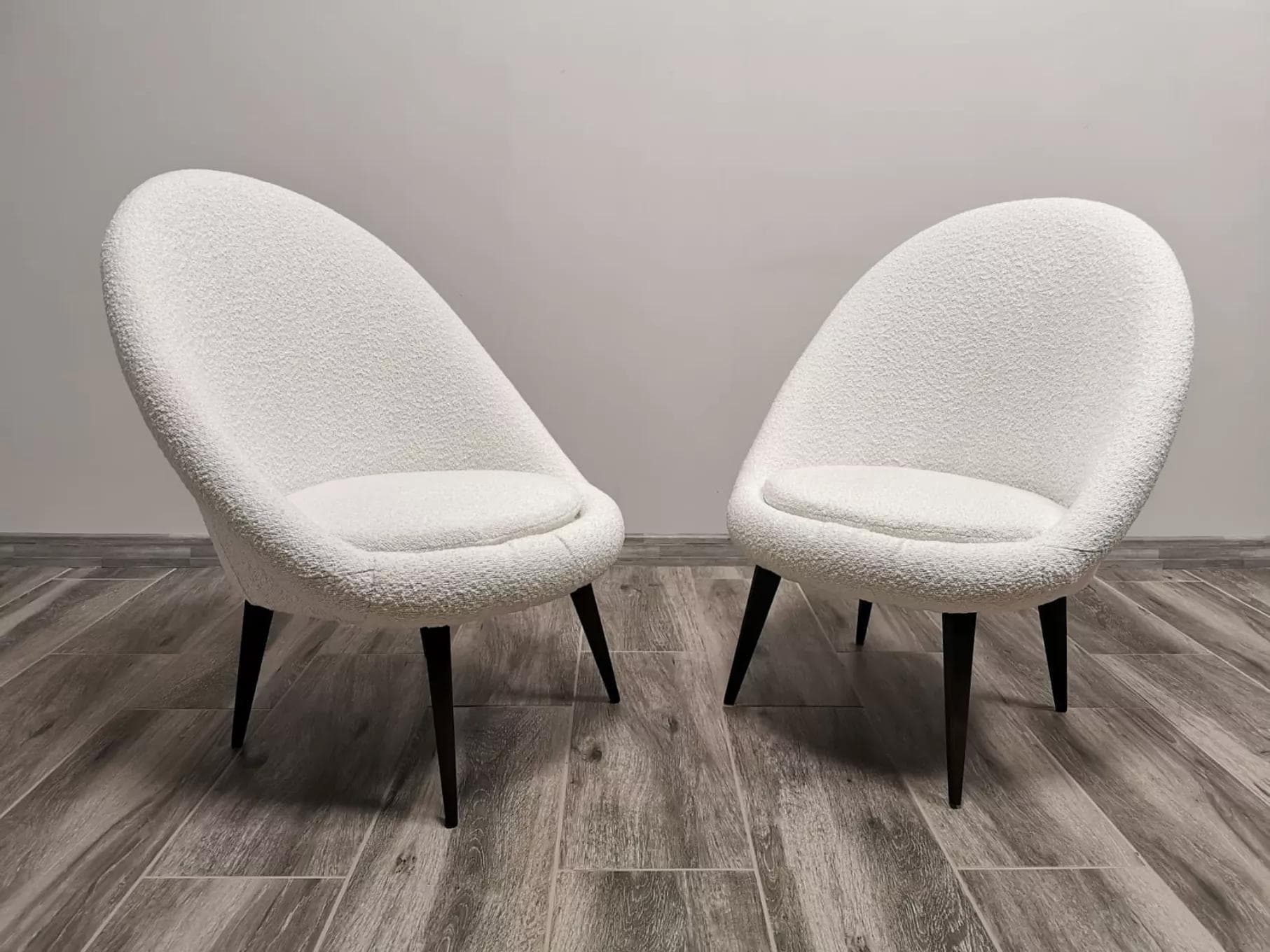 Pair of armchairs, white bouclé, wood, by L. Volak, Tatra Nabytok, Czechoslovakia, 1950s. - 48518