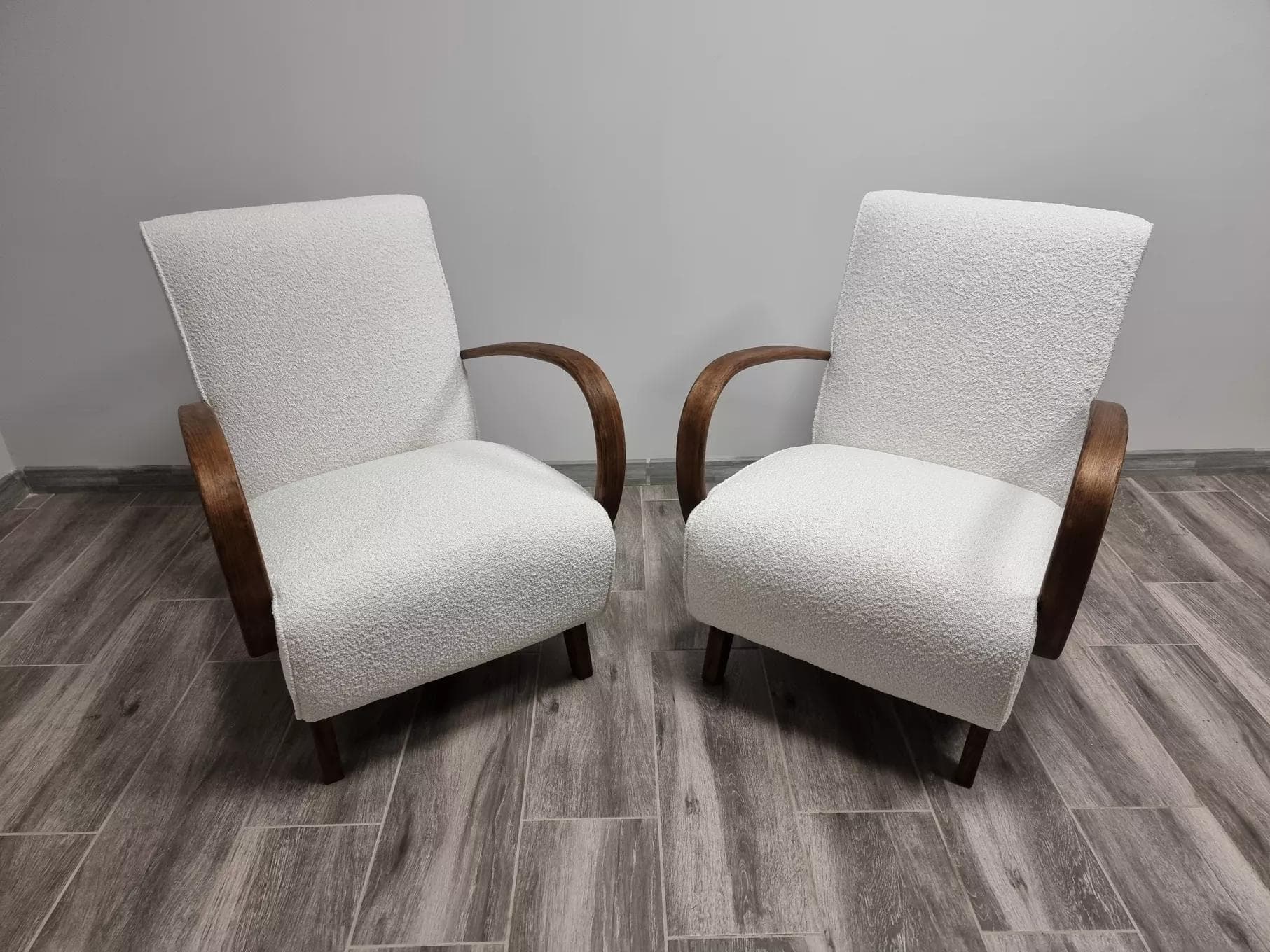 Pair of armchairs H 410, ivory bouclé, walnut wood, by J. Halabala, UP Závody, Czechoslovakia, 1960s. - 48446