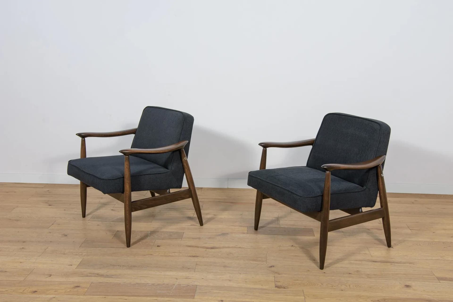 Pair of armchairs GFM-87, brown wood, black fabric, by J. Kędziorek, Poland, 1970s. - 70473