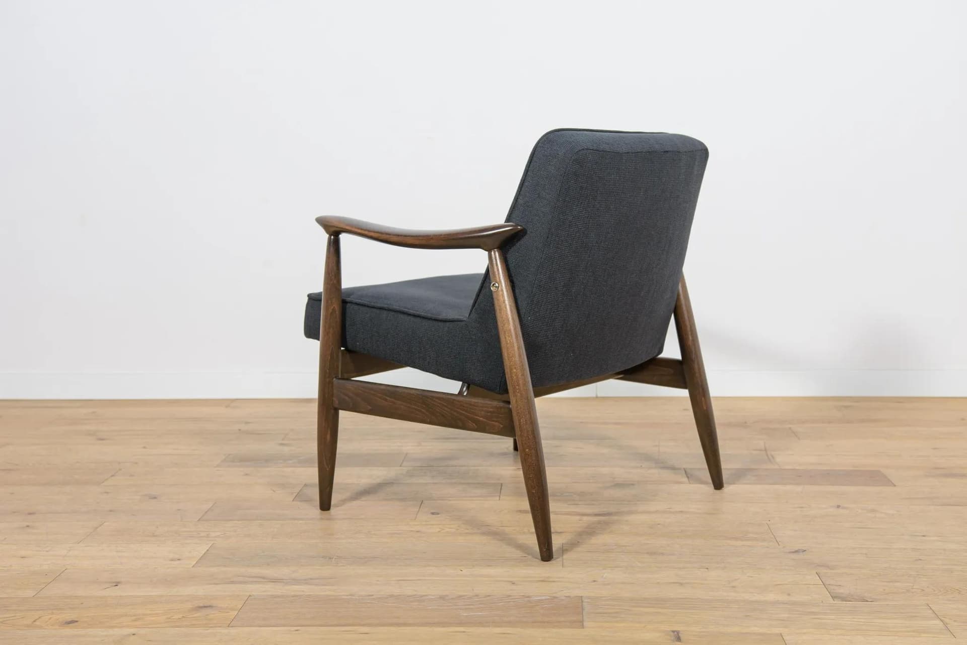 Pair of armchairs GFM-87, brown wood, black fabric, by J. Kędziorek, Poland, 1970s. - 70474