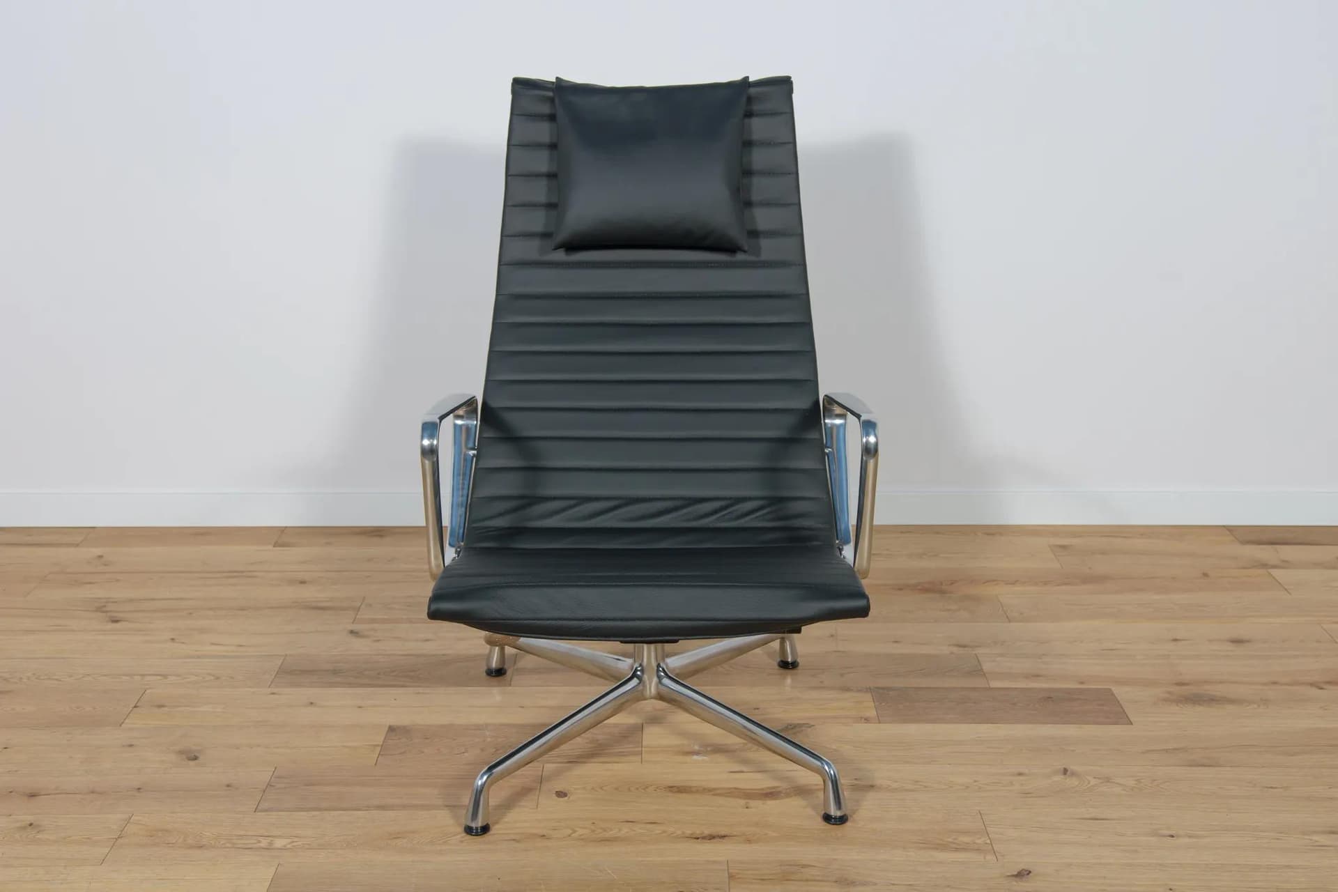 Lounge chair and ottoman EA124 & EA125, black leather, aluminium, by C. & R. Eames, Vitra, Germany, 1980s. - 70067
