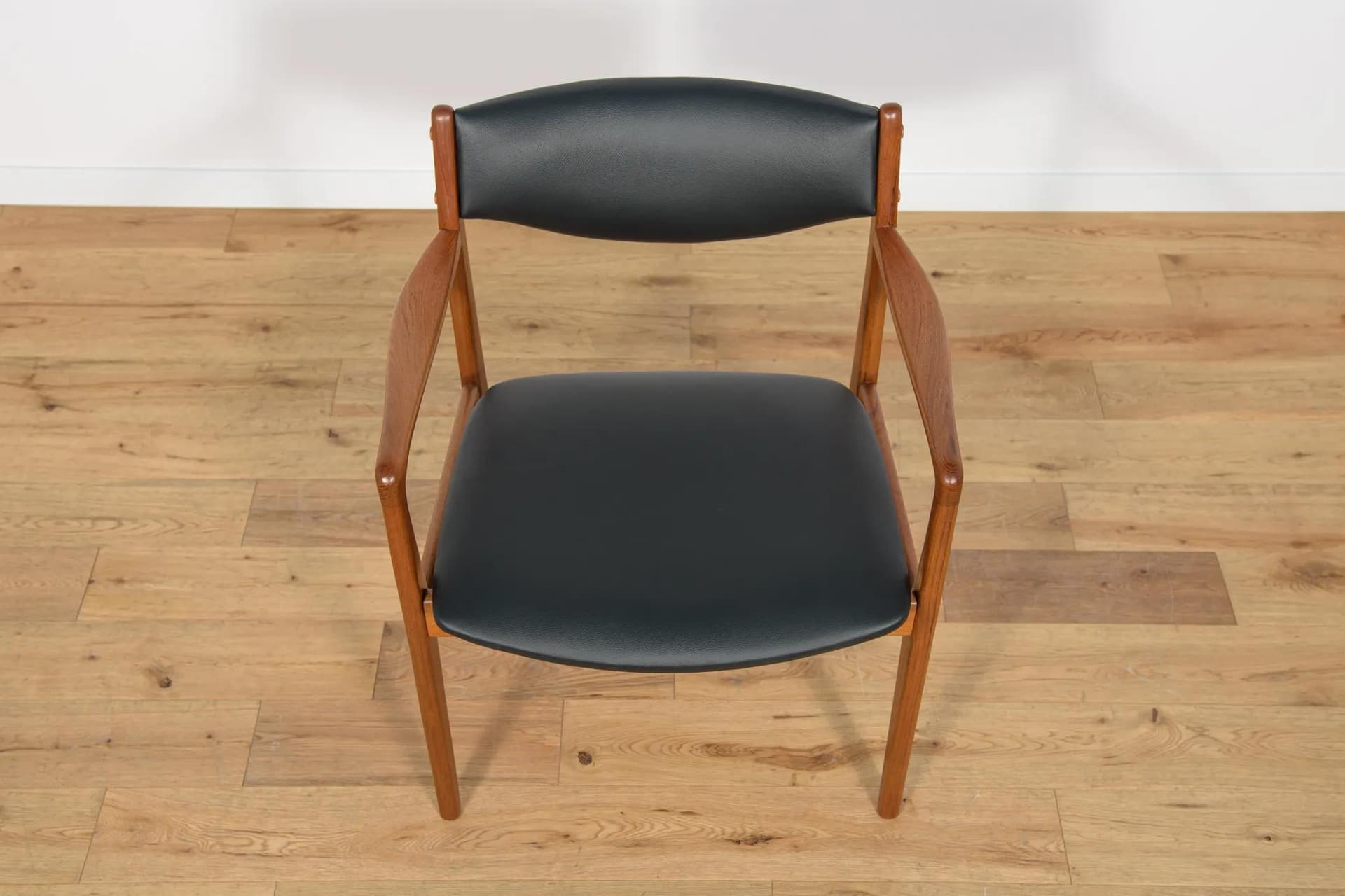 Armchair, brown teak, black leather, Denmark, 1960s. - 73830