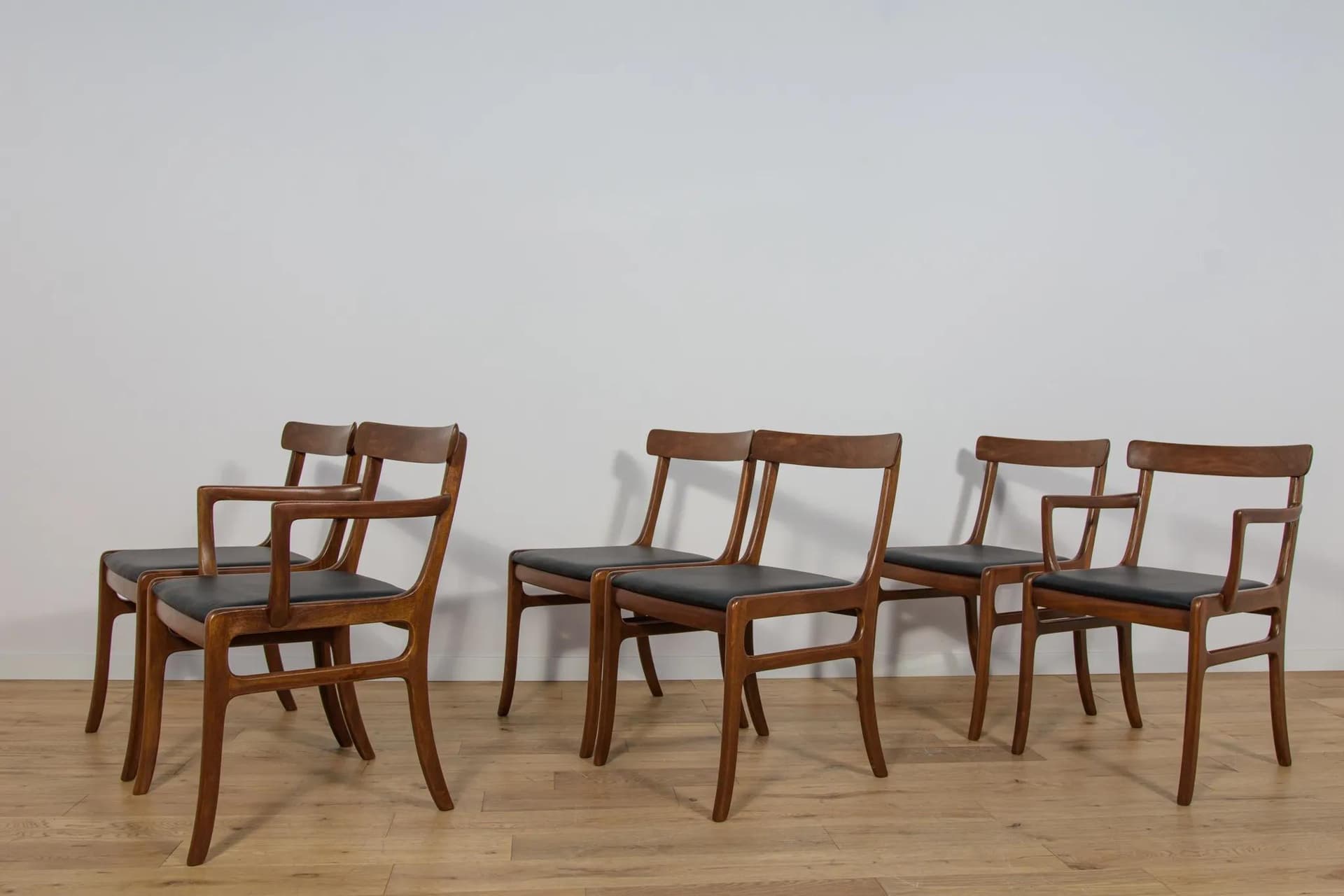 Set of Four Chairs and Two Armchairs Rungstedlund, brown mahogany, black leather, by O. Wanscher, Poul Jeppesens Møbelfabrik, Denmark, 1960s. - 75022