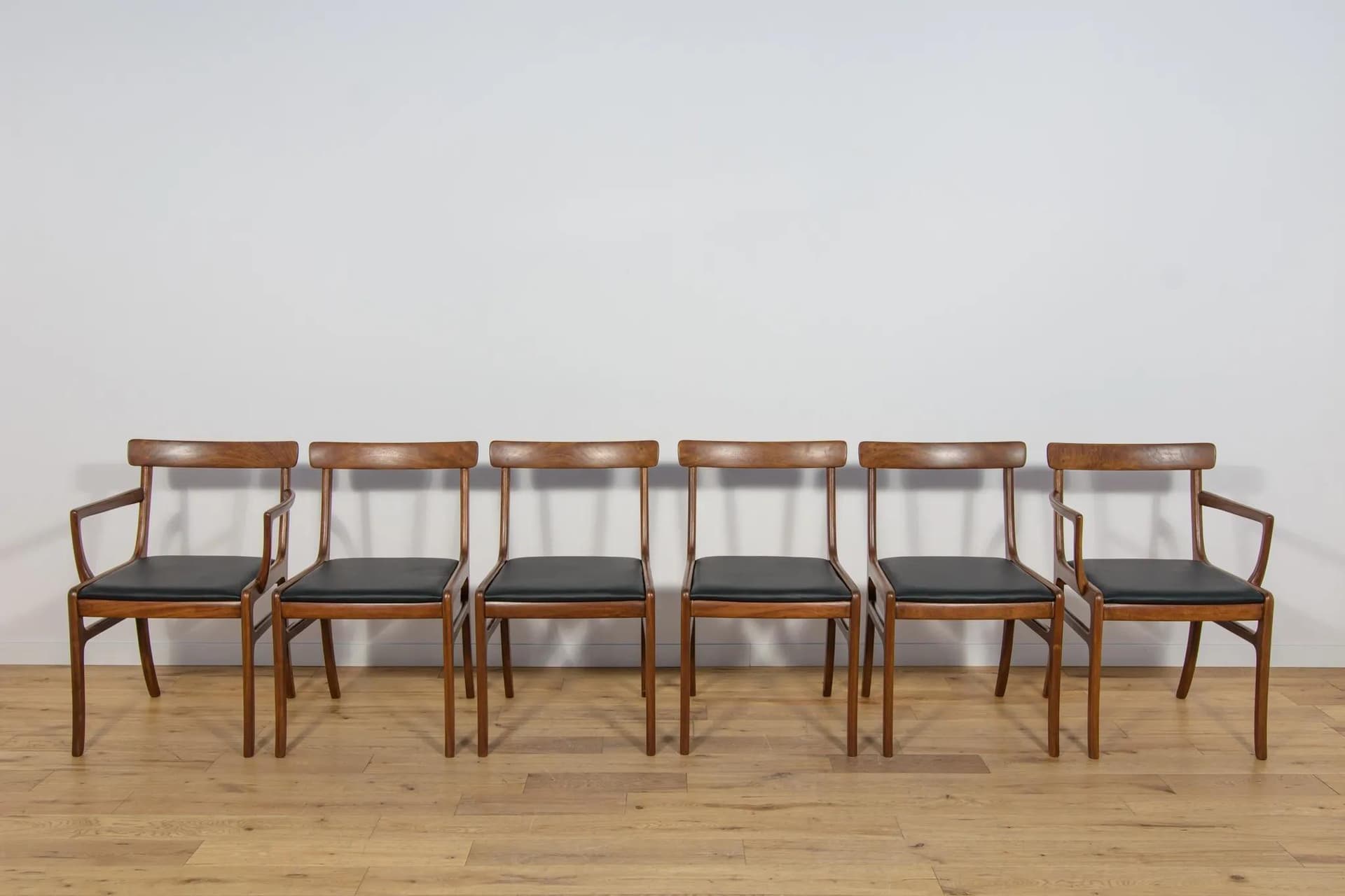 Set of Four Chairs and Two Armchairs Rungstedlund, brown mahogany, black leather, by O. Wanscher, Poul Jeppesens Møbelfabrik, Denmark, 1960s. - 75021
