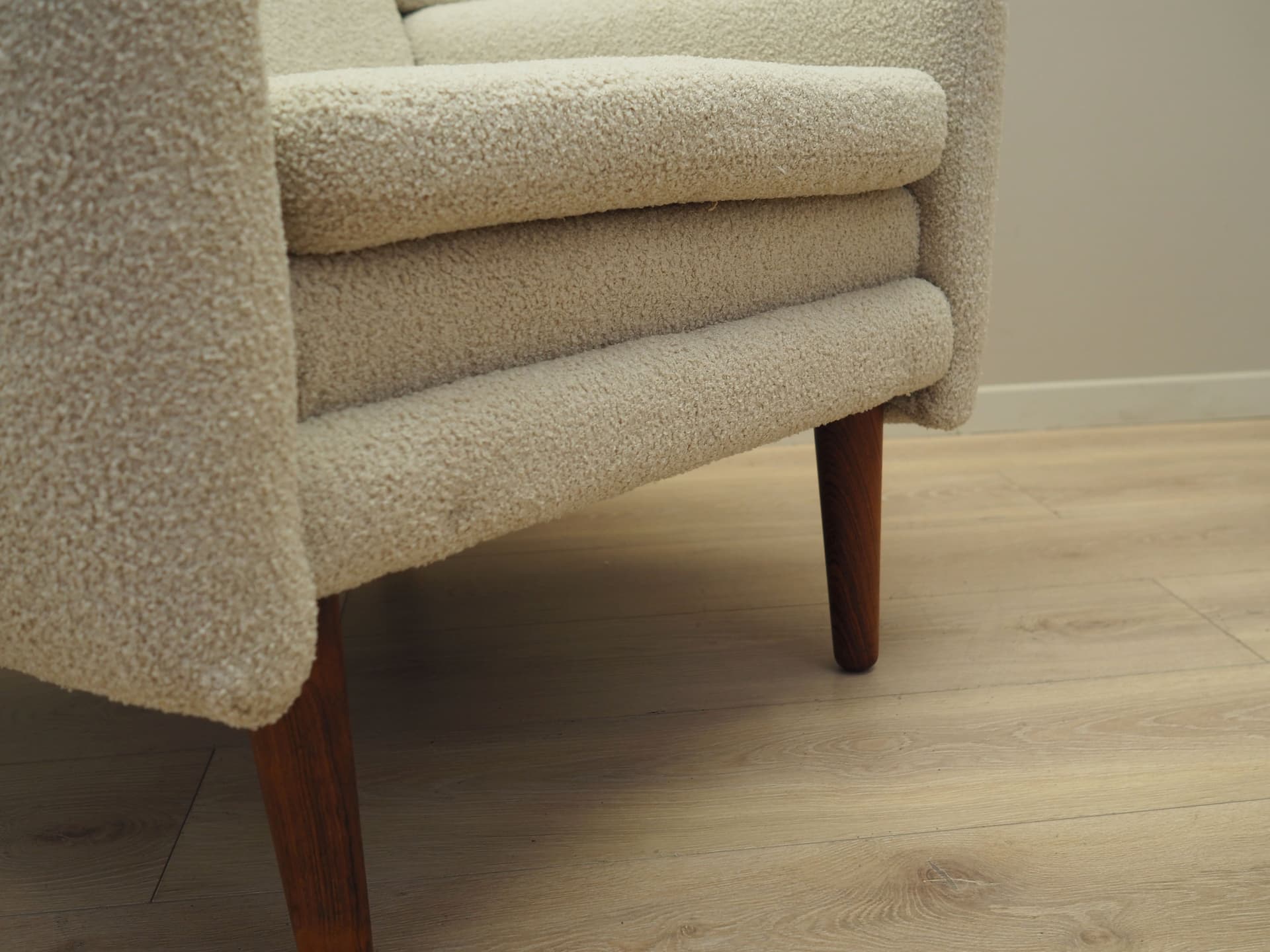 Armchair, ivory bouclé, rosewood, Denmark, 1970s. - 78649