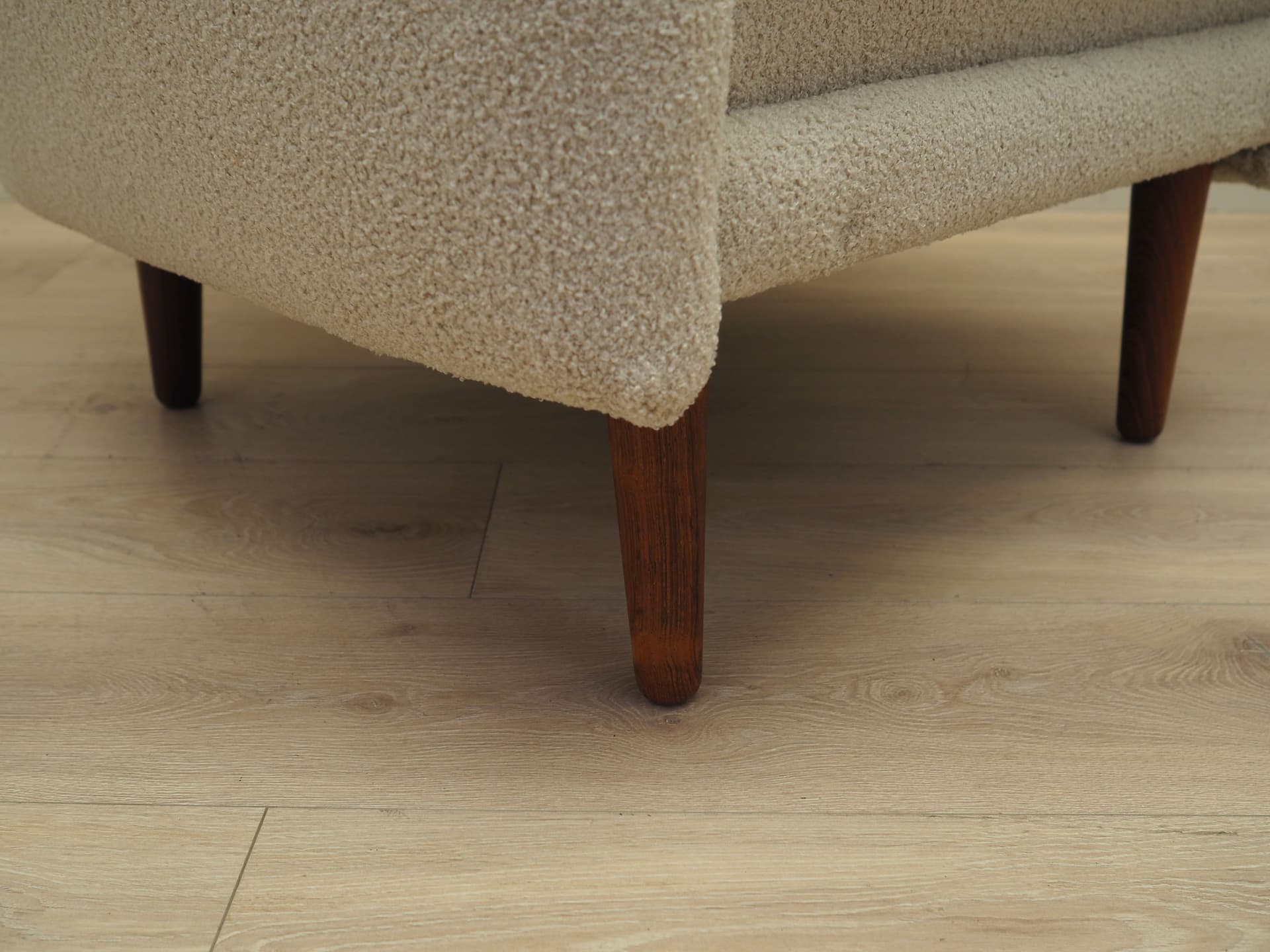 Armchair, ivory bouclé, rosewood, Denmark, 1970s. - 78650