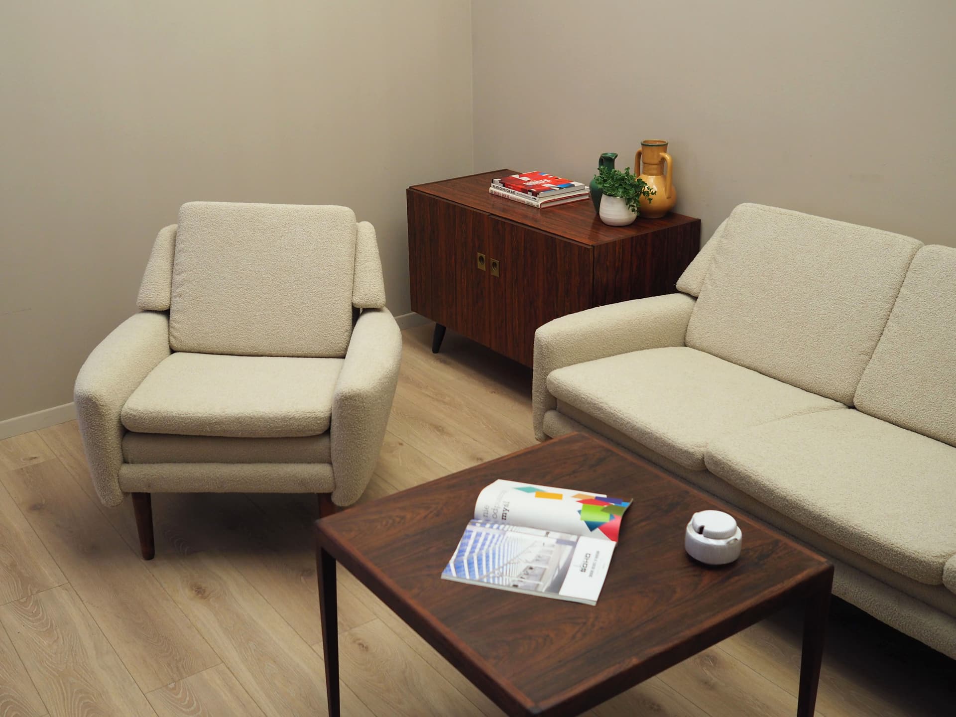 Armchair, ivory bouclé, rosewood, Denmark, 1970s. - 78651