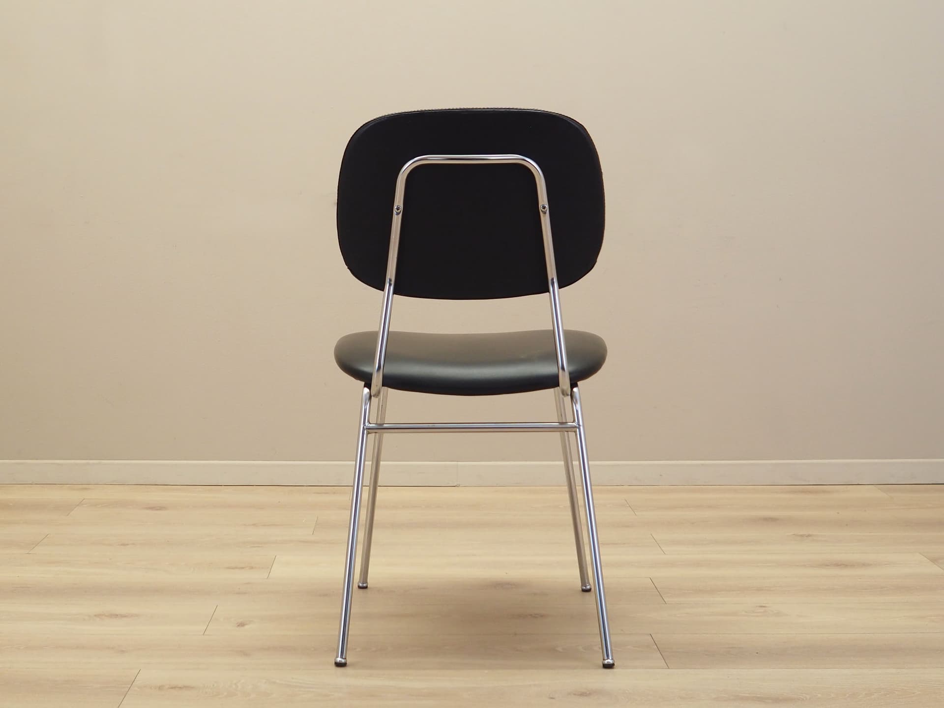 Chair, black, artificial leather, chromed metal, Italy, 1970s. - 82874