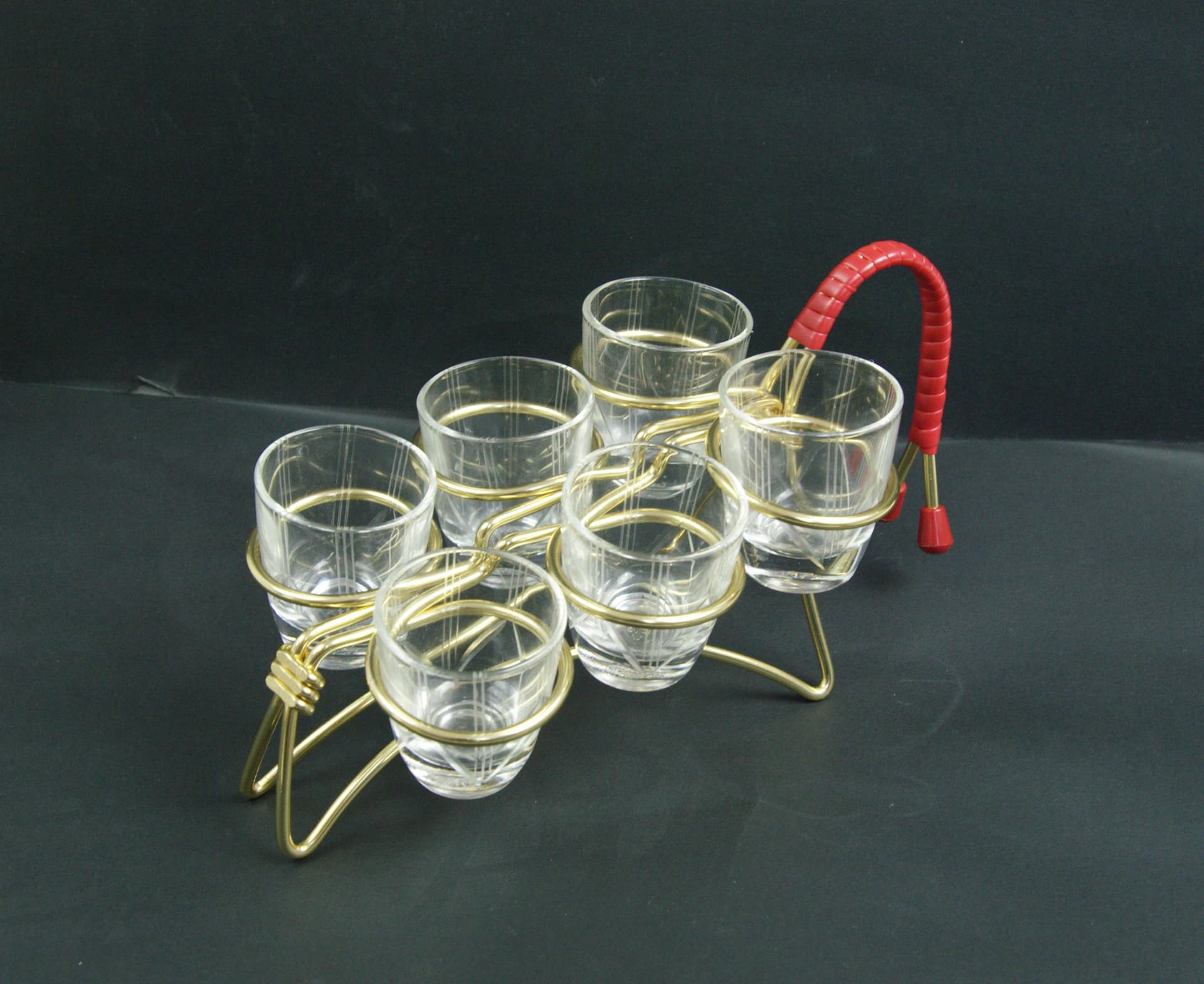 Set of shot glasses with stand, transparent glass, gold metal, Poland, 1960s. - 86727