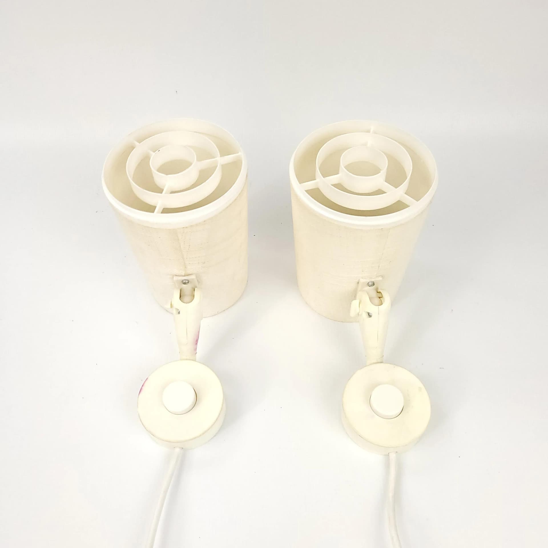 Pair of wall sconces Elidus, ivory white, fabric, metal, plastic, Sweden, 1970s. - 85405